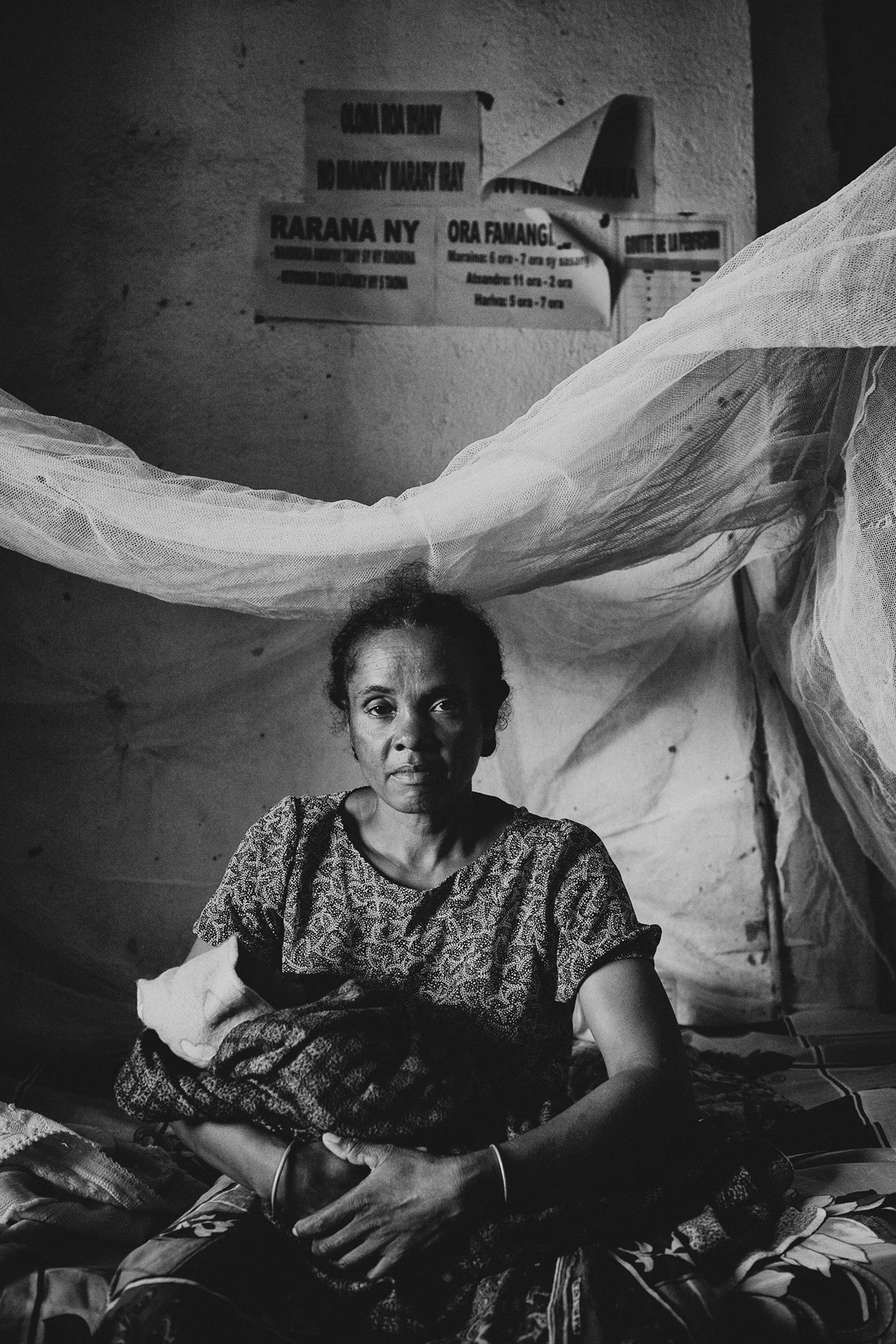 Tognazy holding her nephew Avotra, in her arms, in Betroka, Madagascar. In December 2012, Tognazy and her sister&ndash;then pregnant with Avotra &ndash; fled from their village of Voromiantsa, which had been set on fire by the soldiers during Operation Tandroka, a government offensive against cattle thieves in the region. Avotra was born in the forest and his mother died while giving birth. Tognazy walked with Avotra in her arms for three days before reaching the city of Betroka.&nbsp;