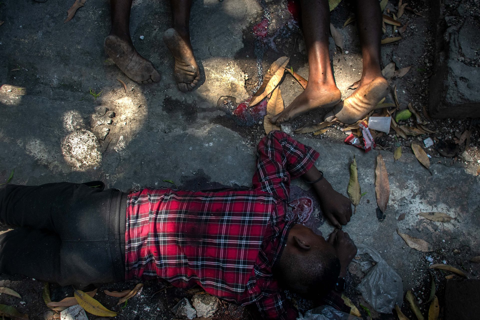 The bodies of civilians killed by suspected gang members in Port-au-Prince, Haiti.