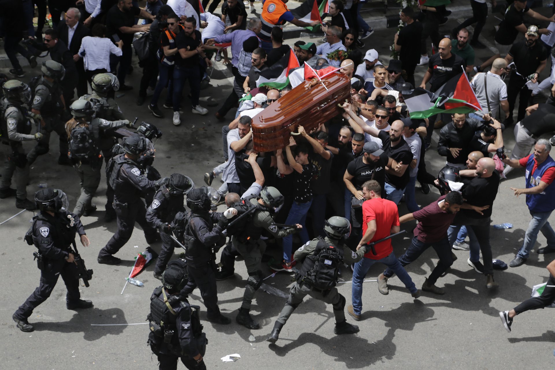 Israeli police beat mourners accompanying the coffin of Al Jazeera journalist Shireen Abu Akleh to her funeral, in East Jerusalem. Police prohibited people from carrying the coffin on foot through the city, which is customary for notable deaths, as mourners chanted &ldquo;We sacrifice our soul and blood for you, Shireen&rdquo;.