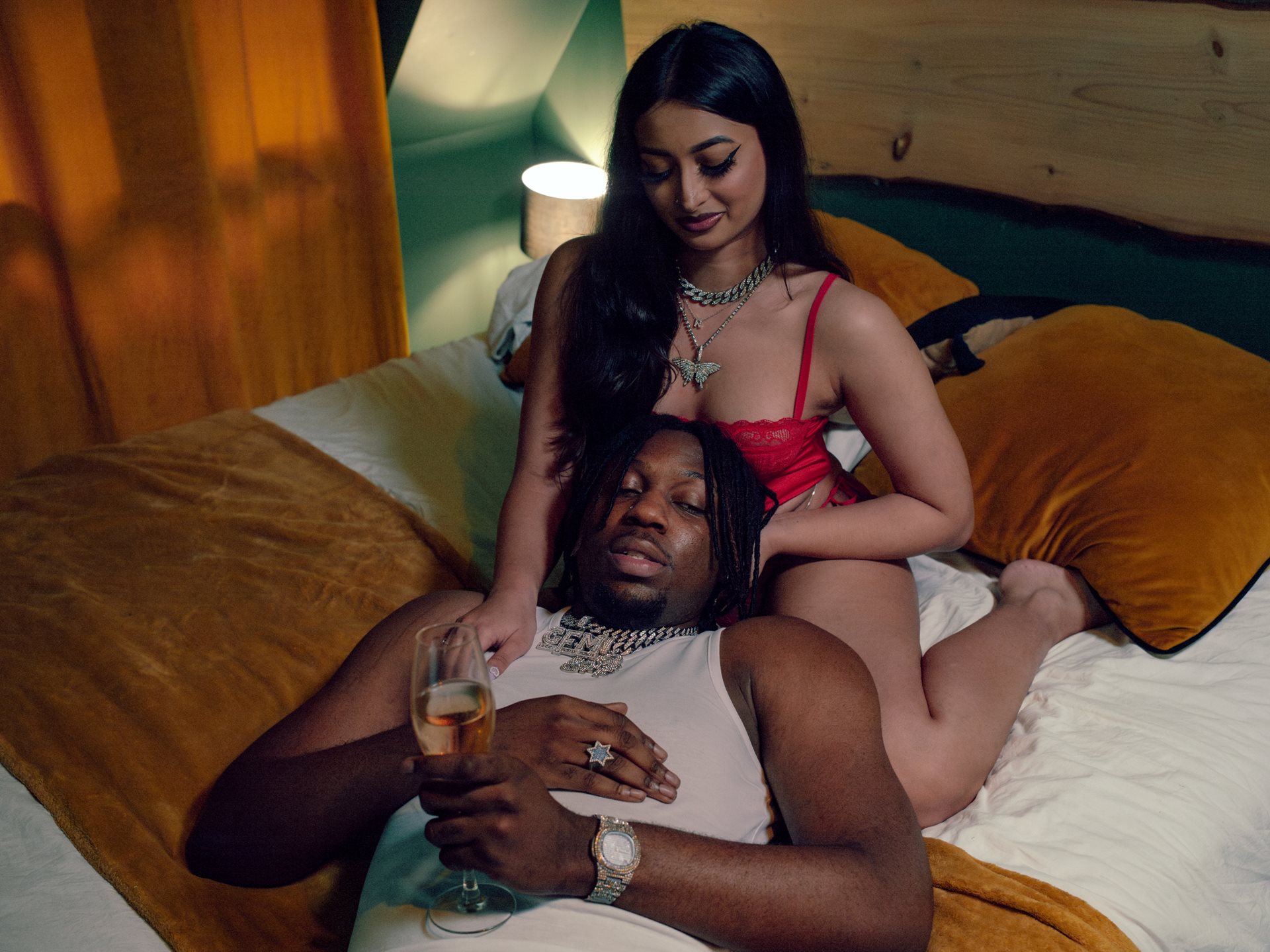 Samy Irzo, a local rapper, and Raisha, an actress appearing as an extra, during the filming of a music video in Orly, France.