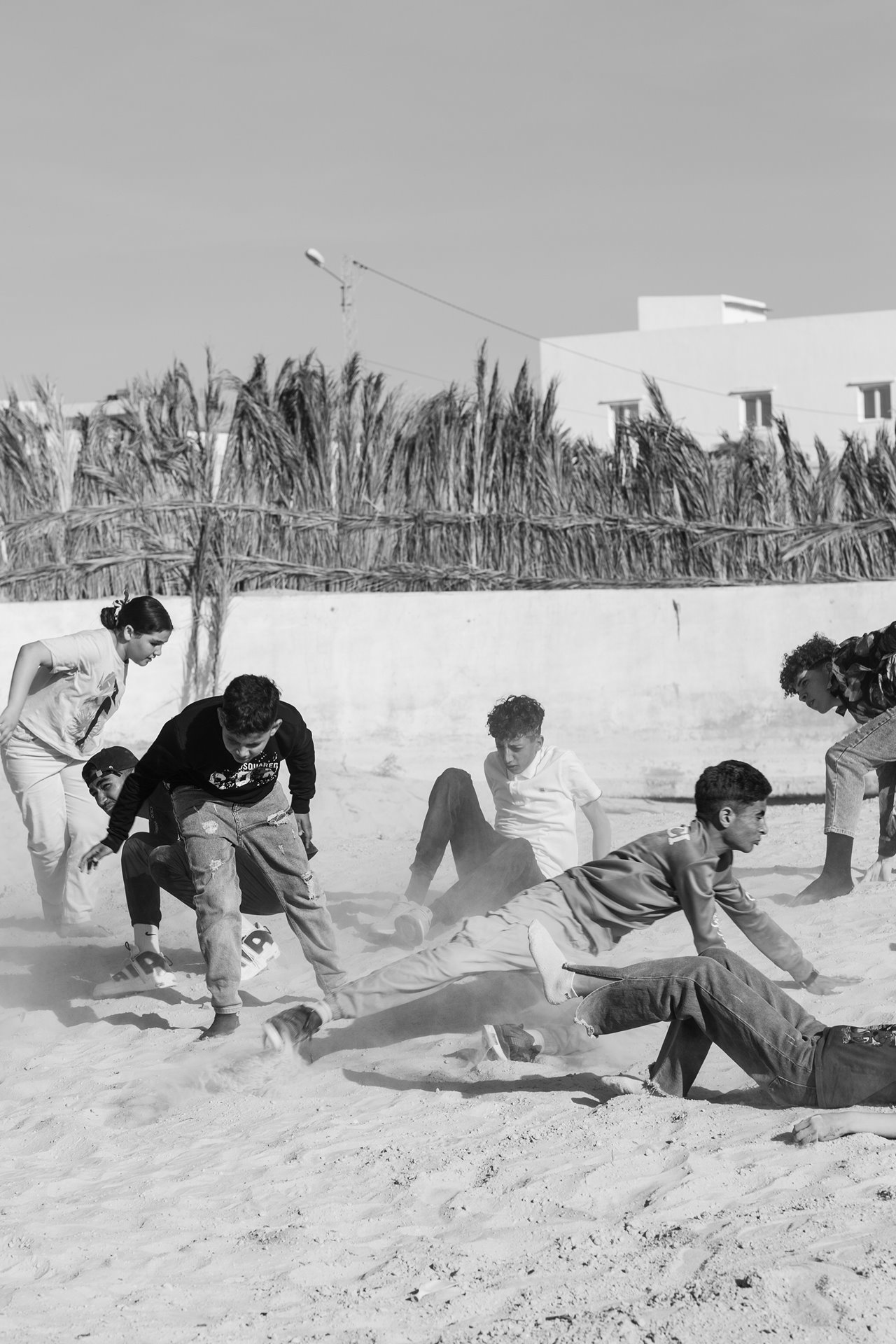 A young theater troupe from the El Guettar youth center in Gafsa rehearse before a performance of a play they are staging in the desert, at the International Sahara Theatre Festival in Nouail, Kebili, Tunisia.