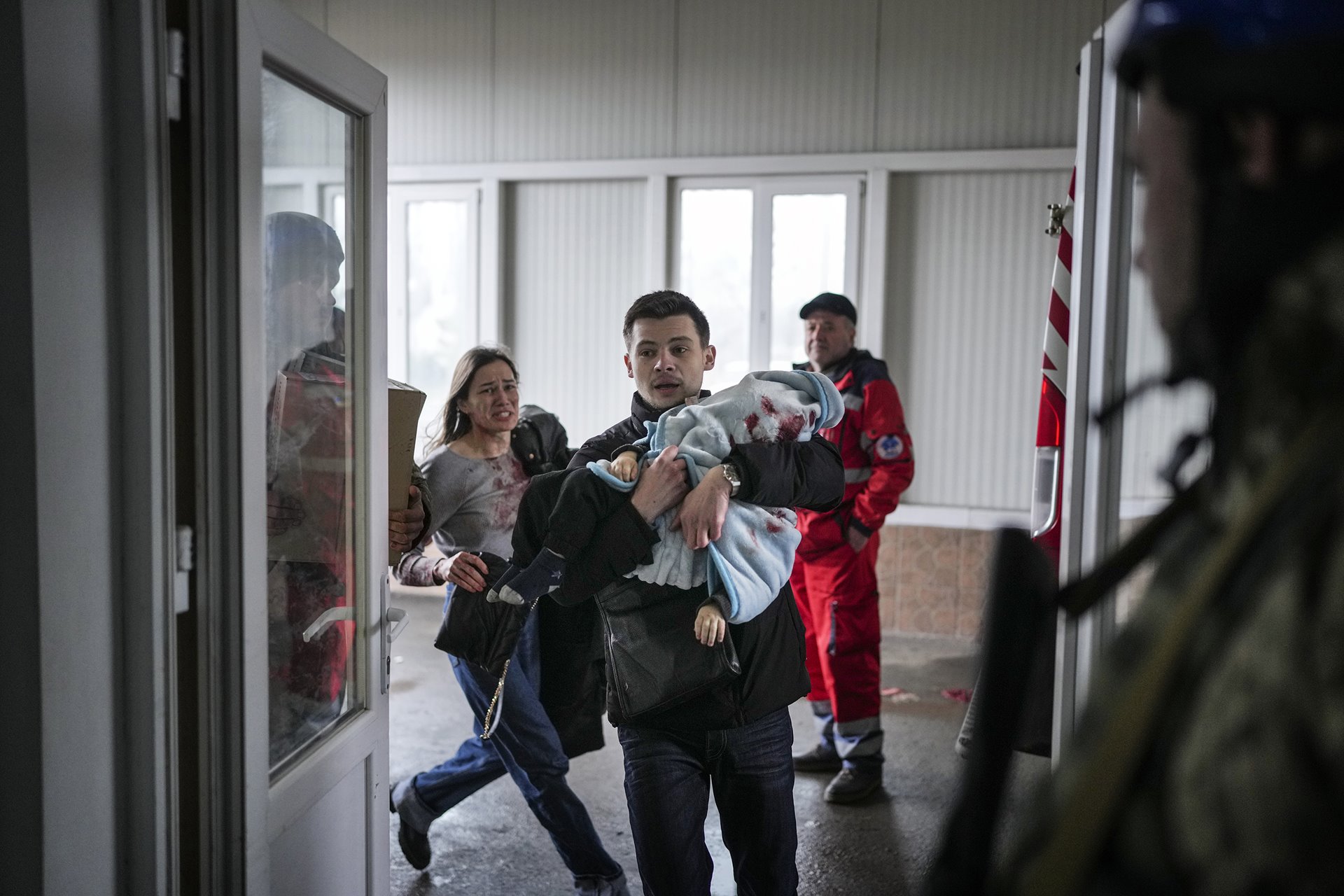 <p>Marina Yatsko and her boyfriend Oleksandr Kulahin bring her 18-month-old son Kirill, fatally wounded during shelling, to a hospital in Mariupol, Ukraine.</p>
