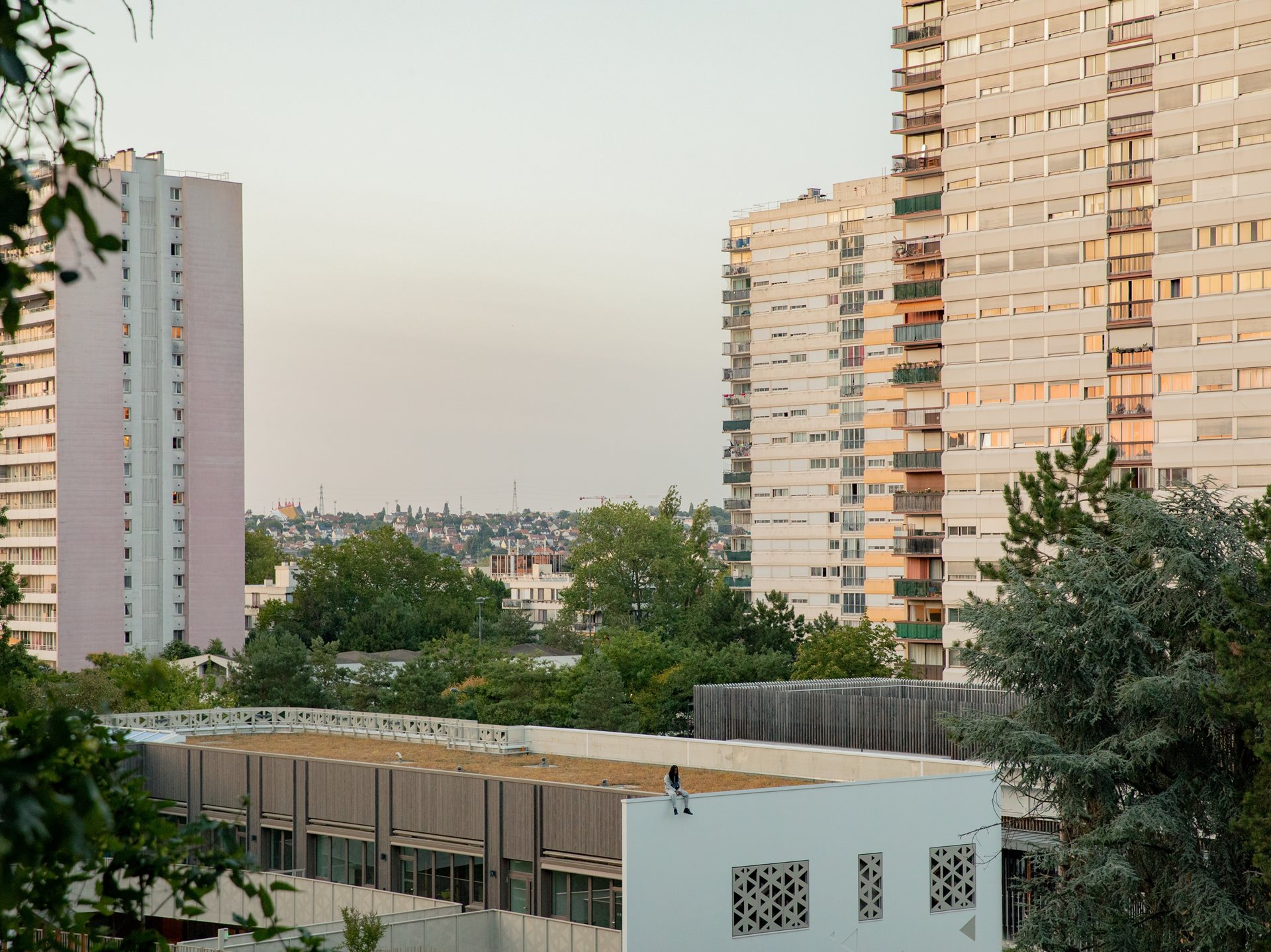 <p>Local resident Ysnear sits on the roof of École élémentaire Paul Langevin in the La Zup housing project in Fontenay-sous-Bois, France.</p>
<br />
&nbsp;