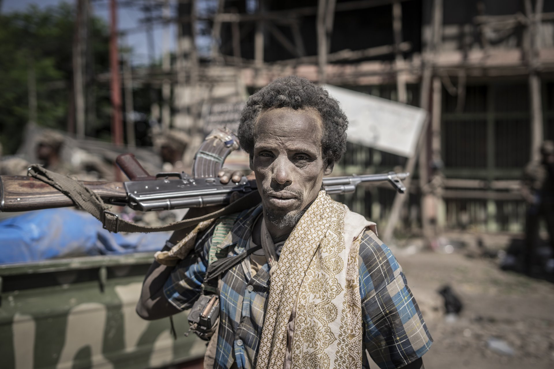 A member of an Afar militia group poses for a photograph in Shewa Robit, Amhara, Ethiopia. Pro-Tigray forces took Shewa Robit on 21 November 2021, and it was re-taken by government forces on 1 December. Afar militia groups had been collaborating closely with the Ethiopian military in fighting pro-Tigray forces.