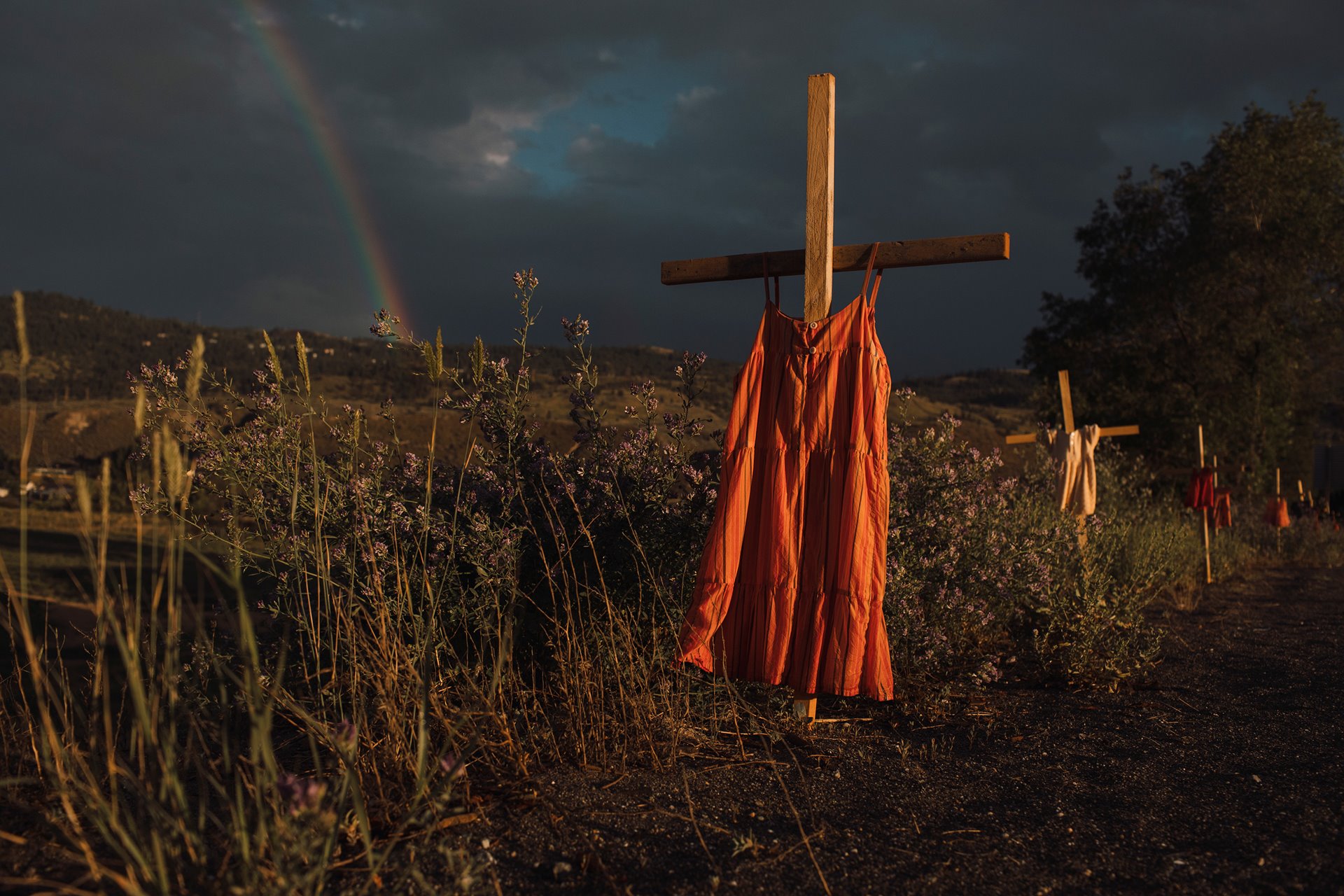 Red dresses hung on crosses along a roadside commemorate children who died at the Kamloops Indian Residential School, an institution created to assimilate Indigenous children, following the detection of as many as 215 unmarked graves, Kamloops, British Columbia.