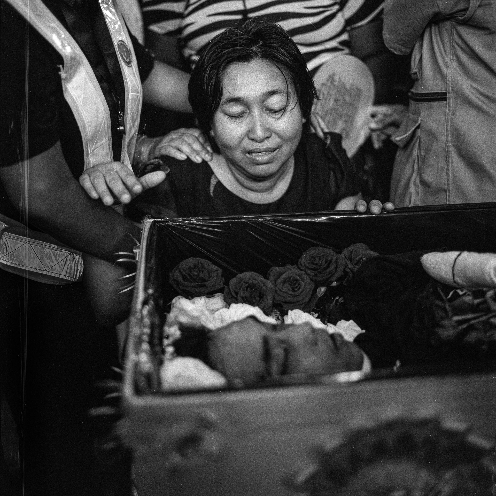 The mother of Chit Min Thu mourns during the funeral service in Yangon, Myanmar. Chit Min Thu was shot dead by security forces using live ammunition against protesters two days earlier.