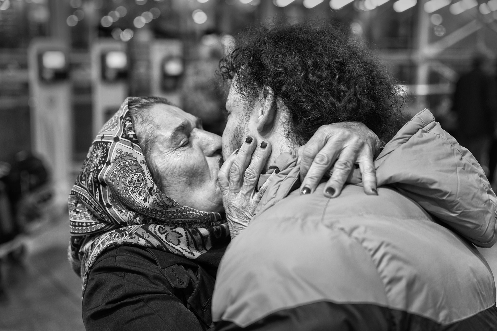 Mohammad (22) shares a farewell with his mother, in Tehran, Iran, before embarking on a journey to Europe to seek better opportunities.