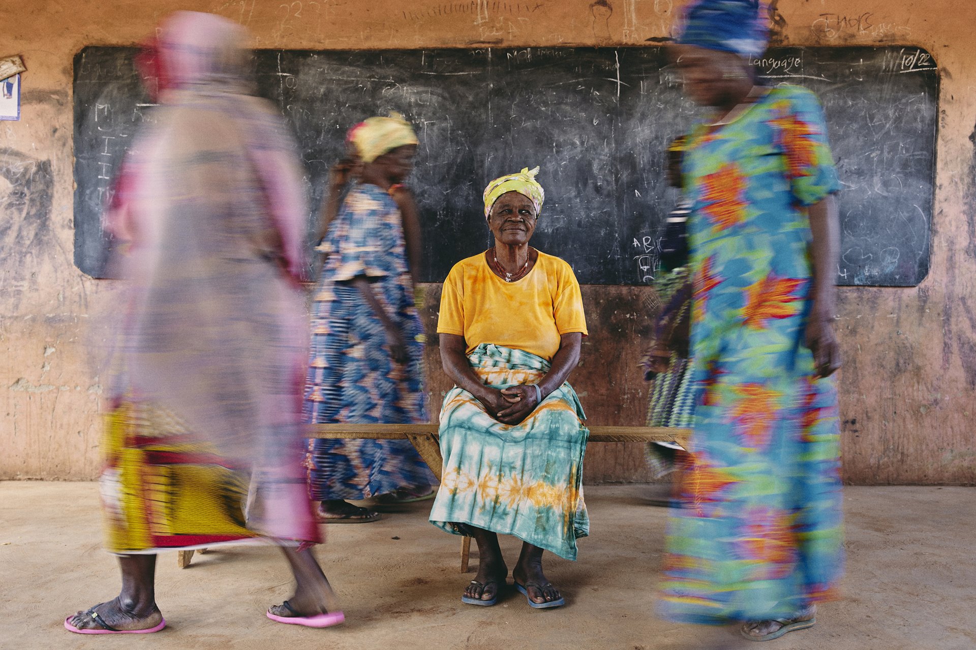 Sugri Zenabu, a <em>mangazia</em> (female community leader) of the Gambaga &ldquo;witch camp&rdquo;, sits encircled by residents in Gambaga, Ghana. Zenabu shows some signs of confusion and memory loss associated with dementia.