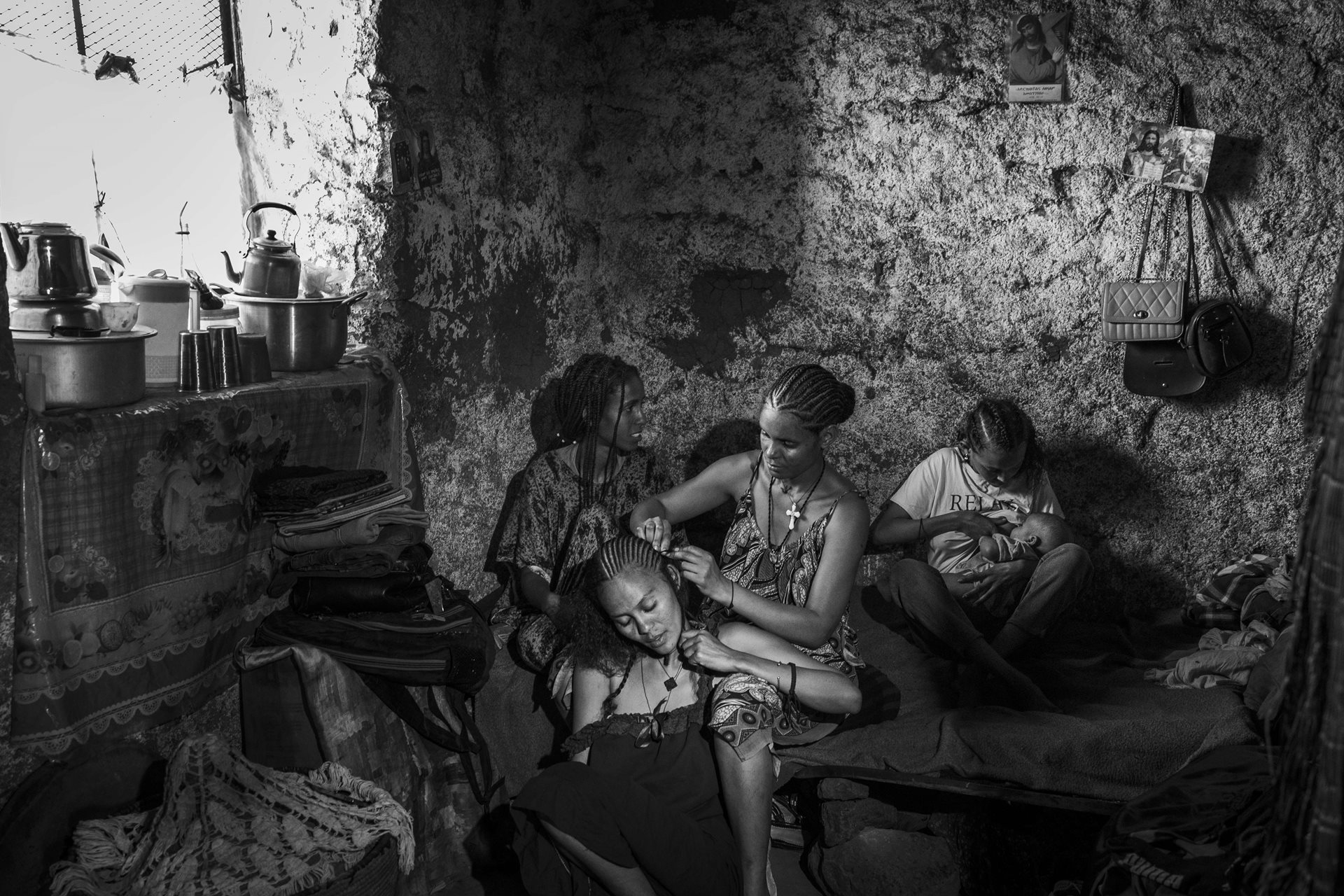 Despite facing immense challenges, young Tigrayan refugee women dedicate time to self-care and socialization. Social interaction provides a crucial support system, helping them process trauma, maintain normalcy, and redefine their identities. Shire, Tigray, Ethiopia.&nbsp;