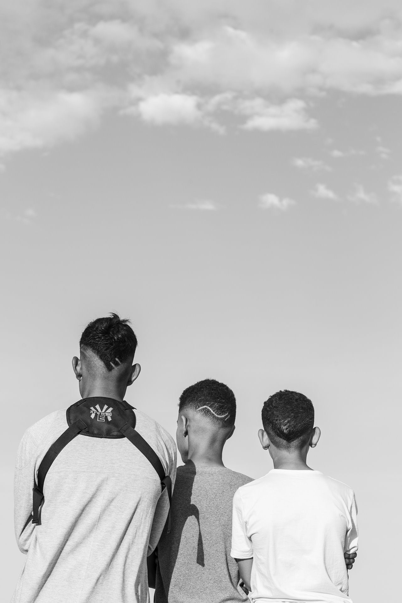 Youths watch the performance of a play in the desert, in Nouail, Kebili, Tunisia.