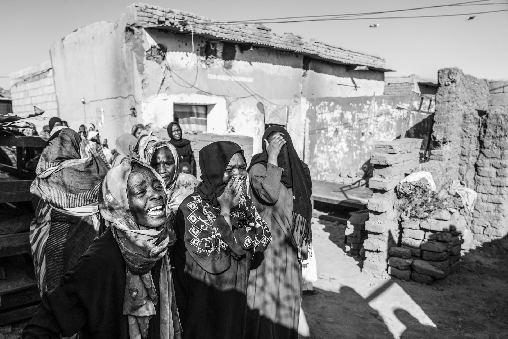 Malak Ahmad mourns her husband, Abobakr Jaber, who was killed by a mortar shell that struck the school where their family was sheltering in Omdurman, Sudan.