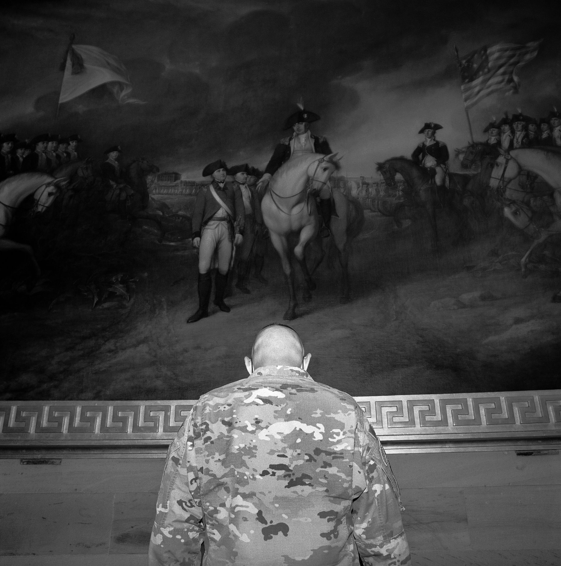 A member of the National Guard called on to protect the Capitol in Washington DC, USA, in the wake of the 6 January attack by pro-Trump supporters, views the &lsquo;Surrender of Lord Cornwallis&rsquo;, which depicts the surrender of the British to an army lead by George Washington during the American Revolution.
