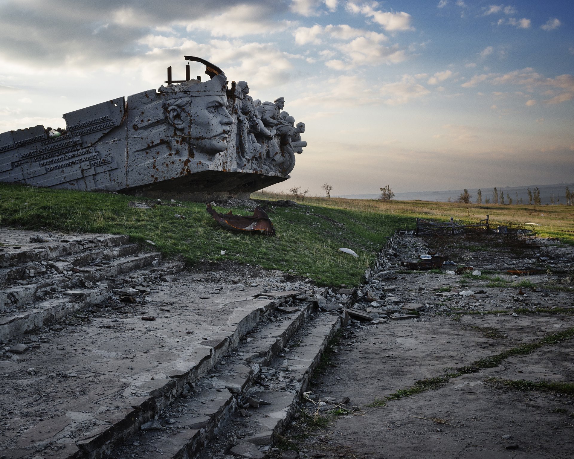 A memorial to soldiers who died in a World War II battle defending their strategically important position on the heights at Savur-Mohyla, Ukraine, lies shattered. After weeks of heavy shelling by both Ukrainian and separatist forces, the obelisk on the memorial collapsed on 21 August 2014.