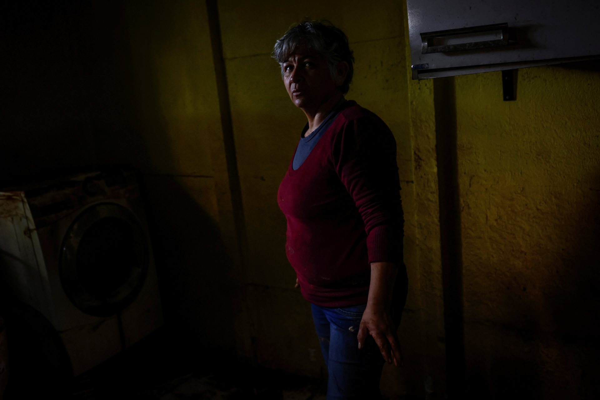 Edite de Almeida (51), farmer and wife of João Engelmann, in her home after the floods. After three days of rain, Edite fled with her husband and daughter to a neighbor&rsquo;s warehouse. &ldquo;I&rsquo;m grateful we survived and I mourn for those who lost family,&rdquo; she said. &ldquo;We&rsquo;ve come from nothing. We&rsquo;ve returned to nothing. Now we start again.&rdquo; Eldorado do Sul, Rio Grande do Sul, Brazil.