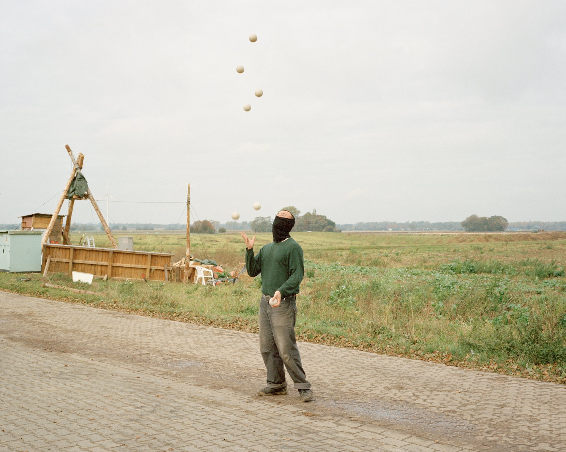 &quot;Stanislav&quot; juggles at a checkpoint along an access road to Lützerath, Germany. Activists tried to monitor traffic so that they could block the road if demolition machinery began to arrive.