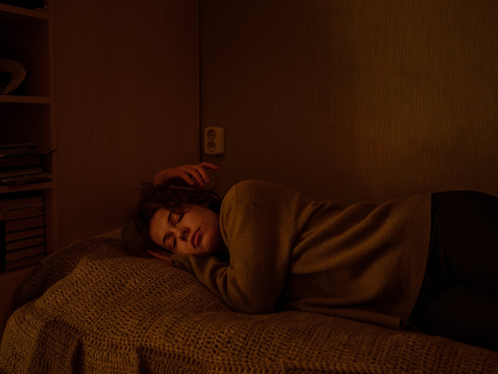 Aliona took this self-portrait in the room she slept in as a child in Tomsk, Russia, in an attempt to work through how it felt to be back in the place she grew up. Did she still belong in this bed, to this house, in this country?&nbsp;