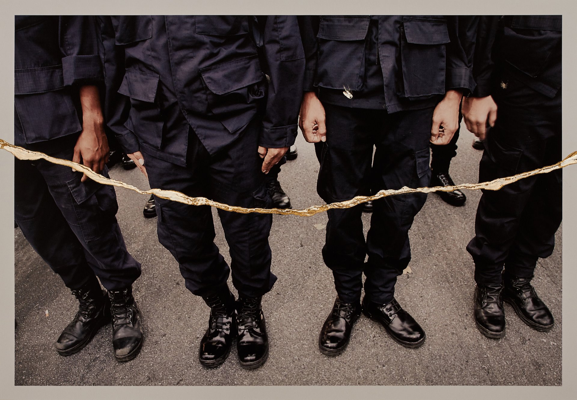 <p>Legs of policemen during a protest in Bangkok, Thailand. According to the photographer, the golden scars on the images represent resilience against the suppression of knowledge, and the possibility of a more beautiful future.</p>
