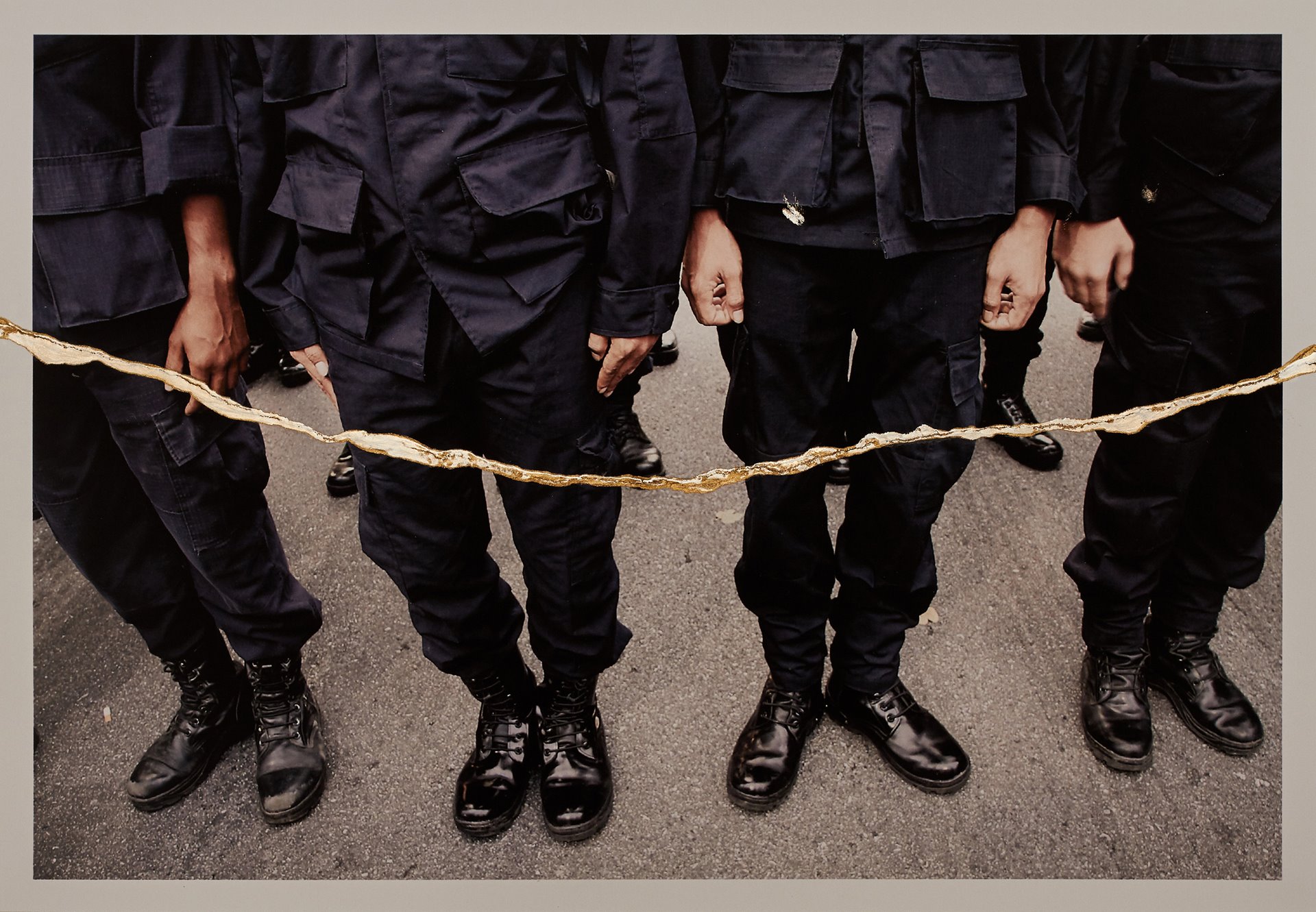 <p>Legs of policemen during a protest in Bangkok, Thailand. According to the photographer, the golden scars on the images represent resilience against the suppression of knowledge, and the possibility of a more beautiful future.</p>
