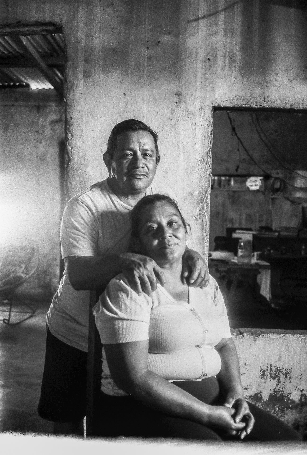 <p>Antonio Mayoral and Guadalupe Cobos pose for a portrait at their home. They are among the last residents of El Bosque. More than 60 families have already relocated inland, losing access to the sea and their traditional fishing livelihoods. El Bosque, Tabasco, Mexico</p>
