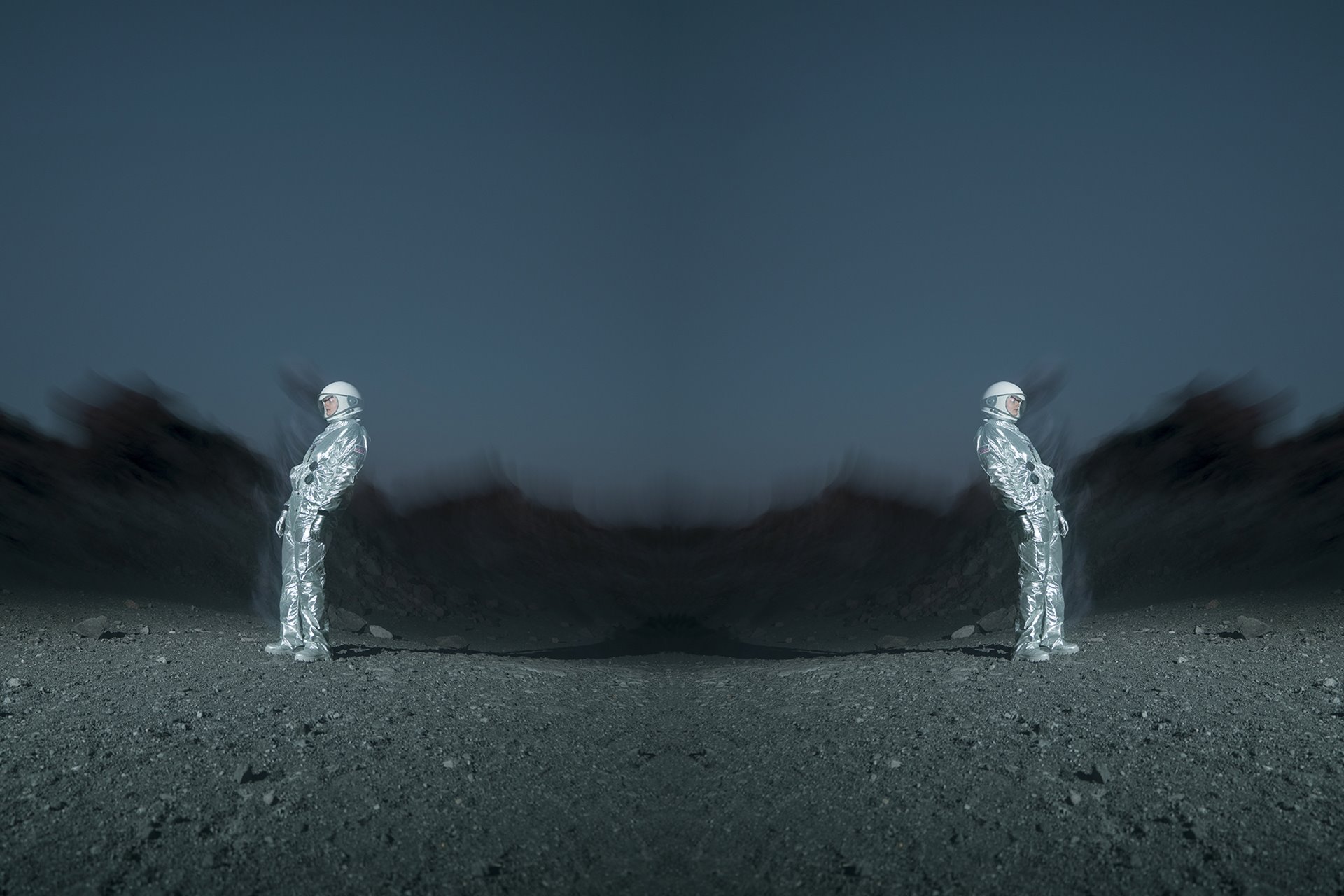 A fictional Gay Space Agency astronaut on the moon. The image is mirrored and warped to evoke the Rorschach inkblot test, one of two &lsquo;heterosexuality tests&rsquo; that astronauts in NASA&rsquo;s Mercury, Gemini, and Apollo programs were required to take. Obsidian Dome, Mono County, California.