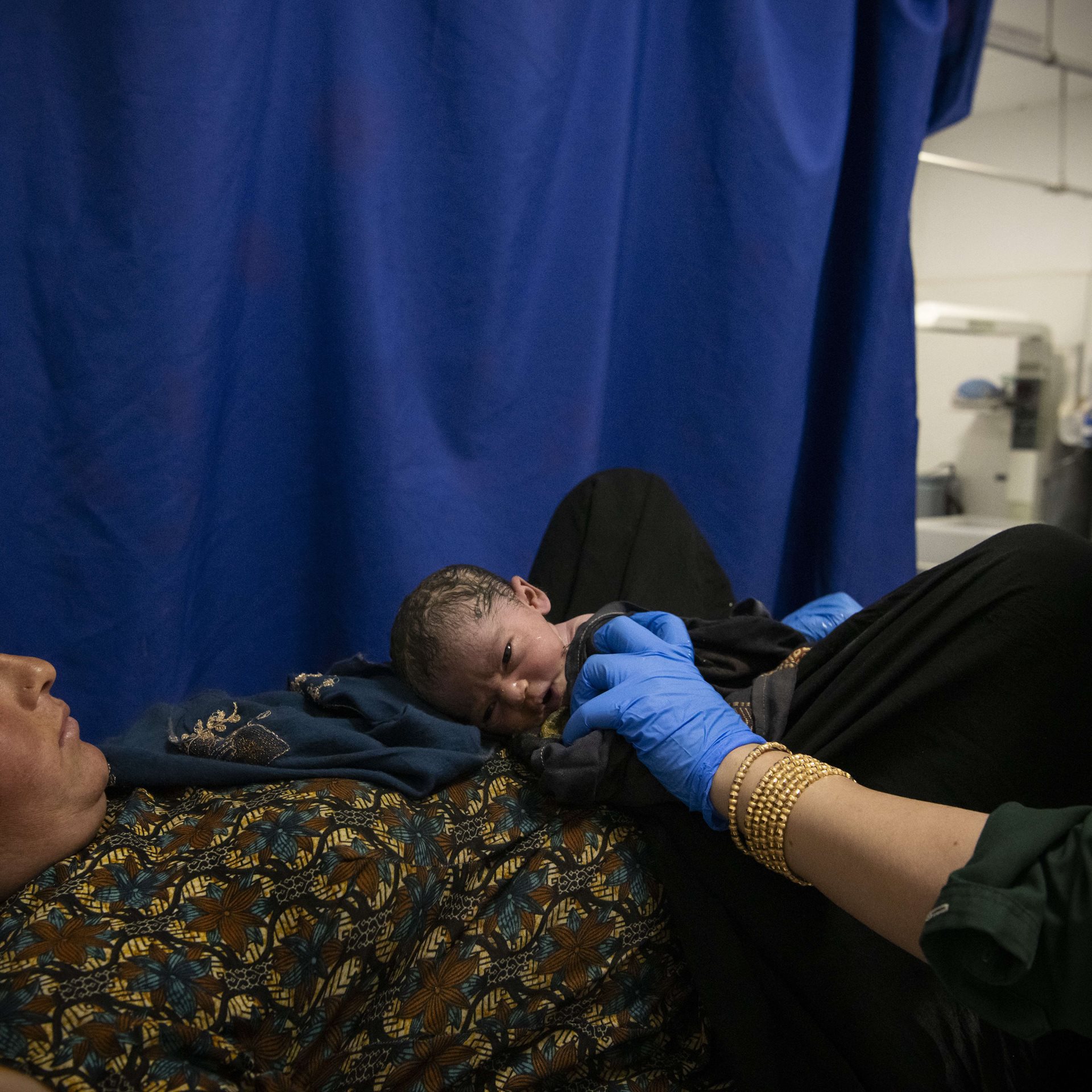 Midwife Suhaila assists at the birth of a baby girl, in Qalat, Afghanistan. The mother expressed disappointment that the child, her fourth, was a girl. &nbsp;Although Suhaila is still permitted to work as a healthcare professional, women may no longer train for midwifery, which will have a devastating impact on women&#39;s healthcare.