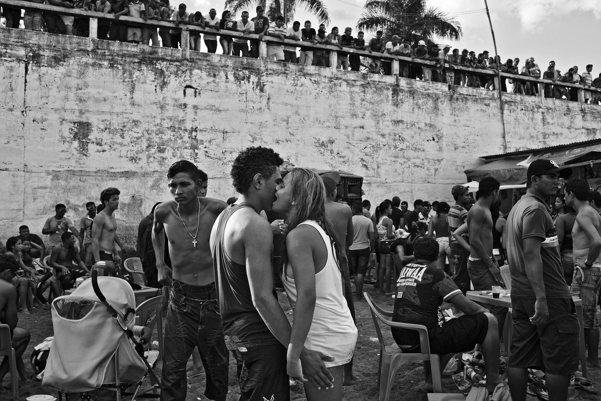 Workers from the Belo Monte Dam construction site party on the Xingu river bank in Altamira, in Pará, in the Brazilian Amazon. During the construction period, on the last weekend of each month when the workers received their salaries, they would head to the city to celebrate. Among thousands of drunk men, it took very little to spark a knife fight. At the peak of the construction for the plant, at the end of 2014 and beginning of 2015, the sites housed more than 25,000 construction workers, 87 percent of them men.