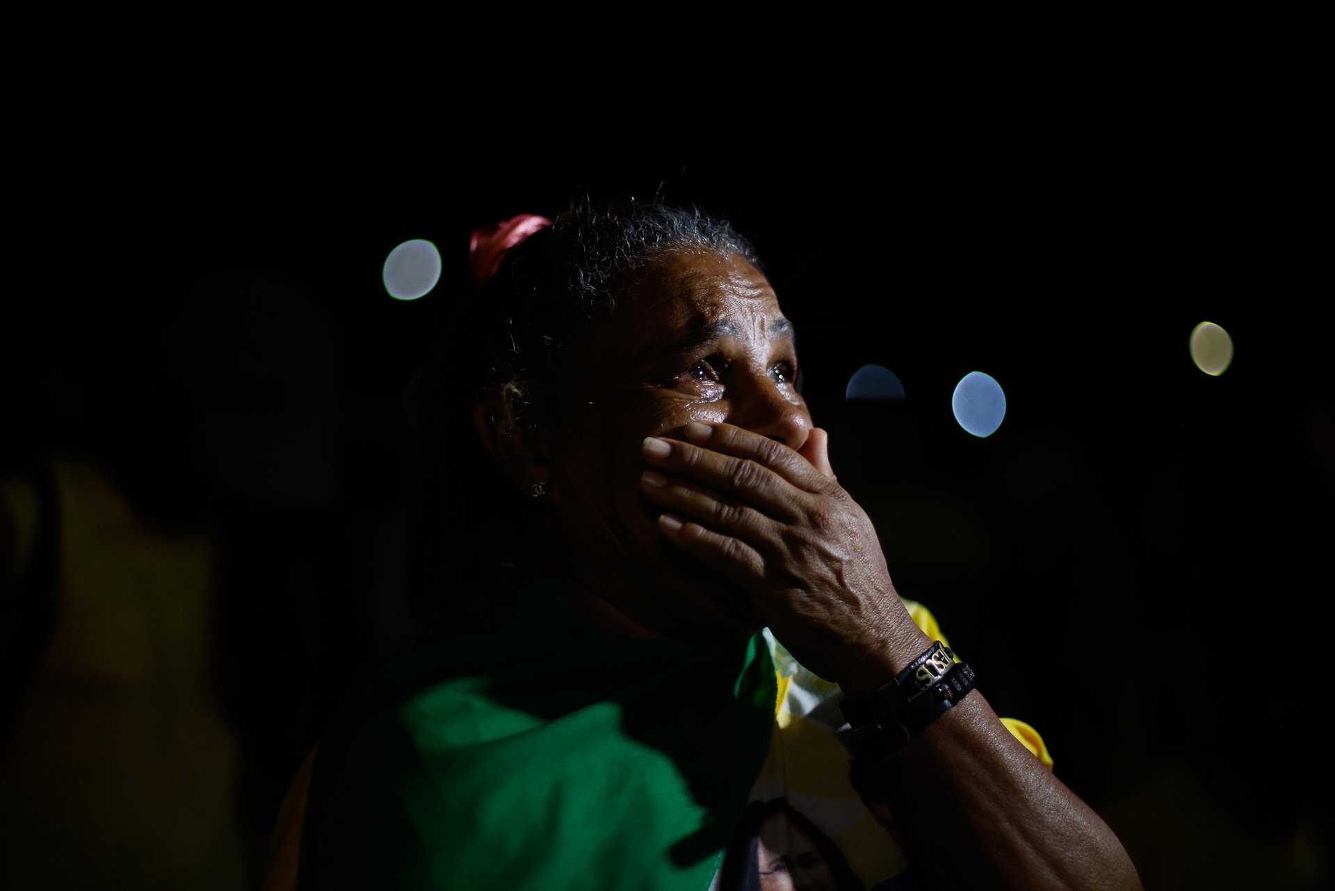 A Bolsonaro supporter in tears after his defeat at the polls to Luiz Inácio Lula da Silva, in The Monumental Axis, Brasilia, Brazil. Jair Bolsonaro is the first Brazilian president to not win re-election since the adoption of the re-election model in 1998.&nbsp;