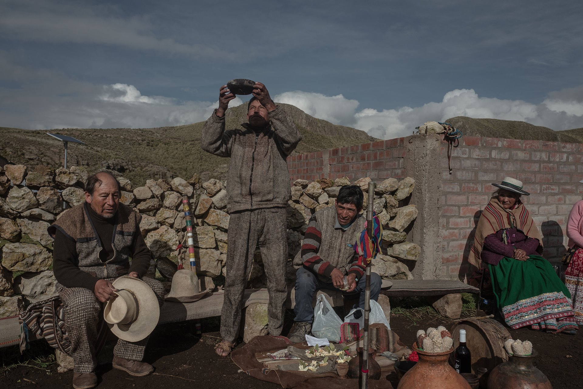 <p>A family of <em>alpaqueros</em> (alpaca farmers) performs a ritual for Pachamama (Mother Earth), in Tisco, Peru.</p>

