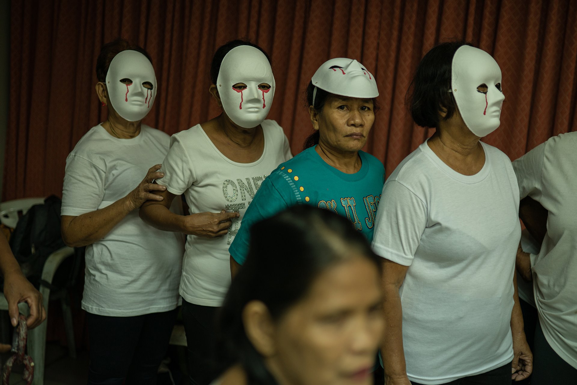 <p>Mothers and widows of war-on-drugs victims rehearse for a theater performance in Tondo, Manila, the Philippines. Sarah Celiz (center) lost two of her sons in 2016 and 2017 and was left to care for her 12 grandchildren. The performance was organized by Paghilom (Healing), a program started in 2016 by former drug user Father Flaviano Villanueva for families of victims of the war on drugs, providing them with support and counseling.&nbsp;</p>
