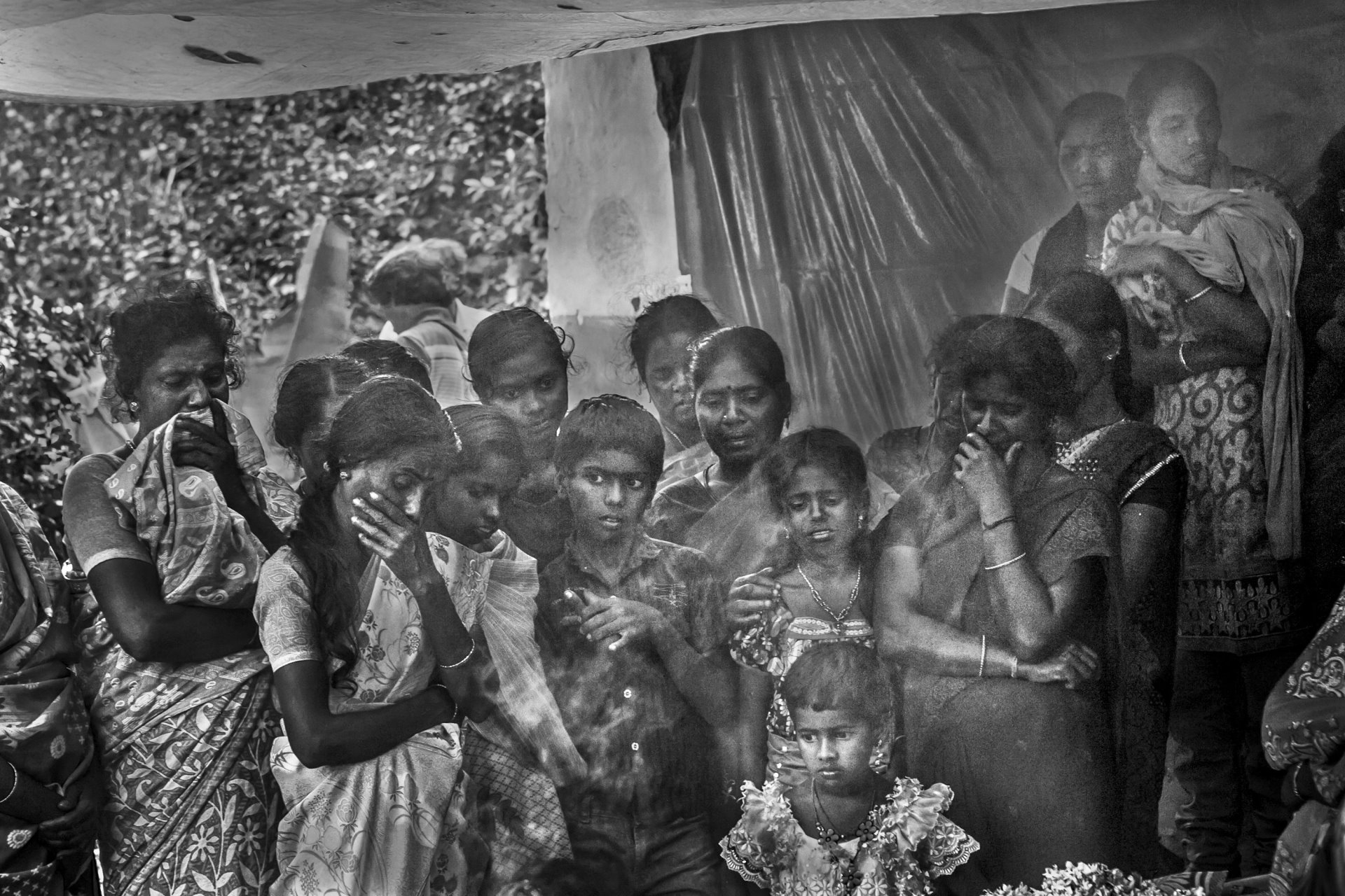 <p>Neighbors in the village of Pattavayal mourn the death of a 38-year-old woman who was killed by a tiger while she was working on the tea estate near Mudumalai Tiger Reserve, Gudalur, Tamil Nadu, India.</p>
