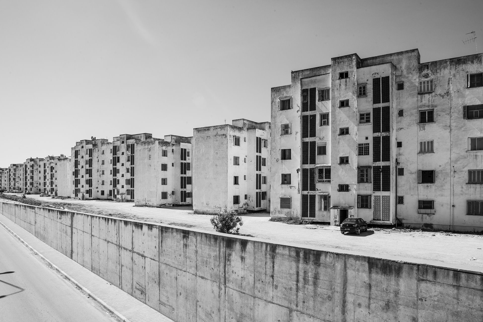 The Ennozha housing complex in Ariana, Tunis, Tunisia, built by the government to meet housing needs in the capital, was intended mainly for the middle class. The government sold the apartments mainly to people who worked in the public sector.