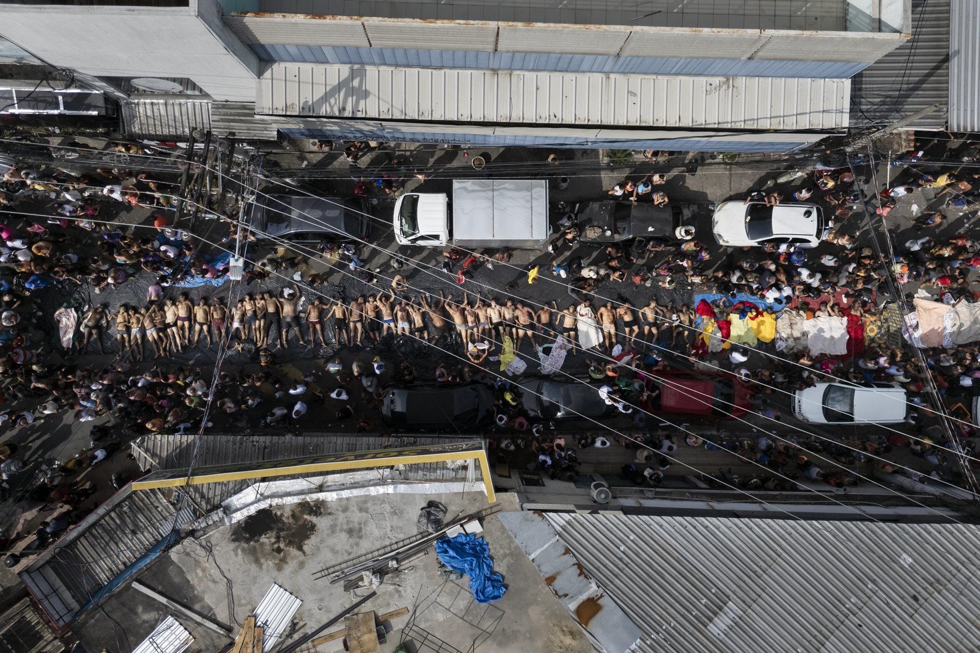 Recovered bodies lie in São Lucas Square, Rio de Janeiro, Brazil. It took four days for authorities to officially identify and release all the victims, disrupting Brazilian funeral and mourning practices.