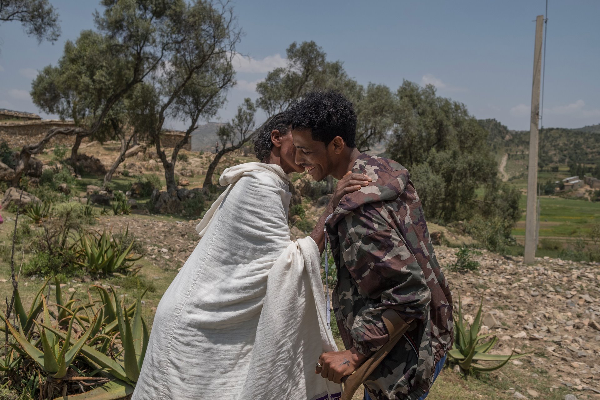 Kibrom Berhane (24) greets his mother for the first time since he joined the Tigray Defense Forces, two years earlier. Saesie Tsada, Ethiopia.