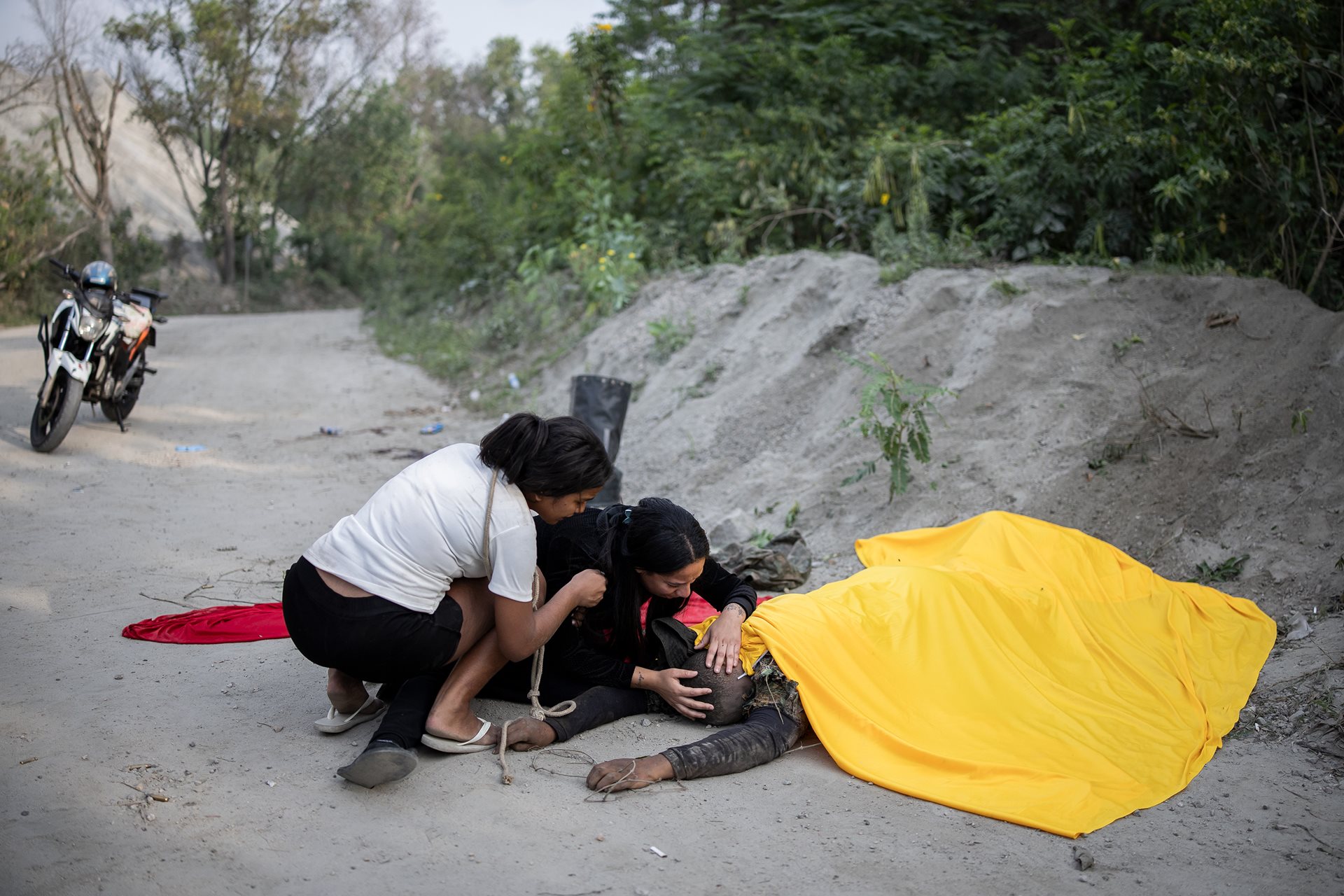 A woman breaks down after finding her husband among the deceased. The vast majority of the 122 casualties were Afro-Brazilians, reinforcing data that shows police violence in Rio de Janeiro disproportionately impacts the city's Afro-Brazilian population. Rio de Janeiro, Brazil.