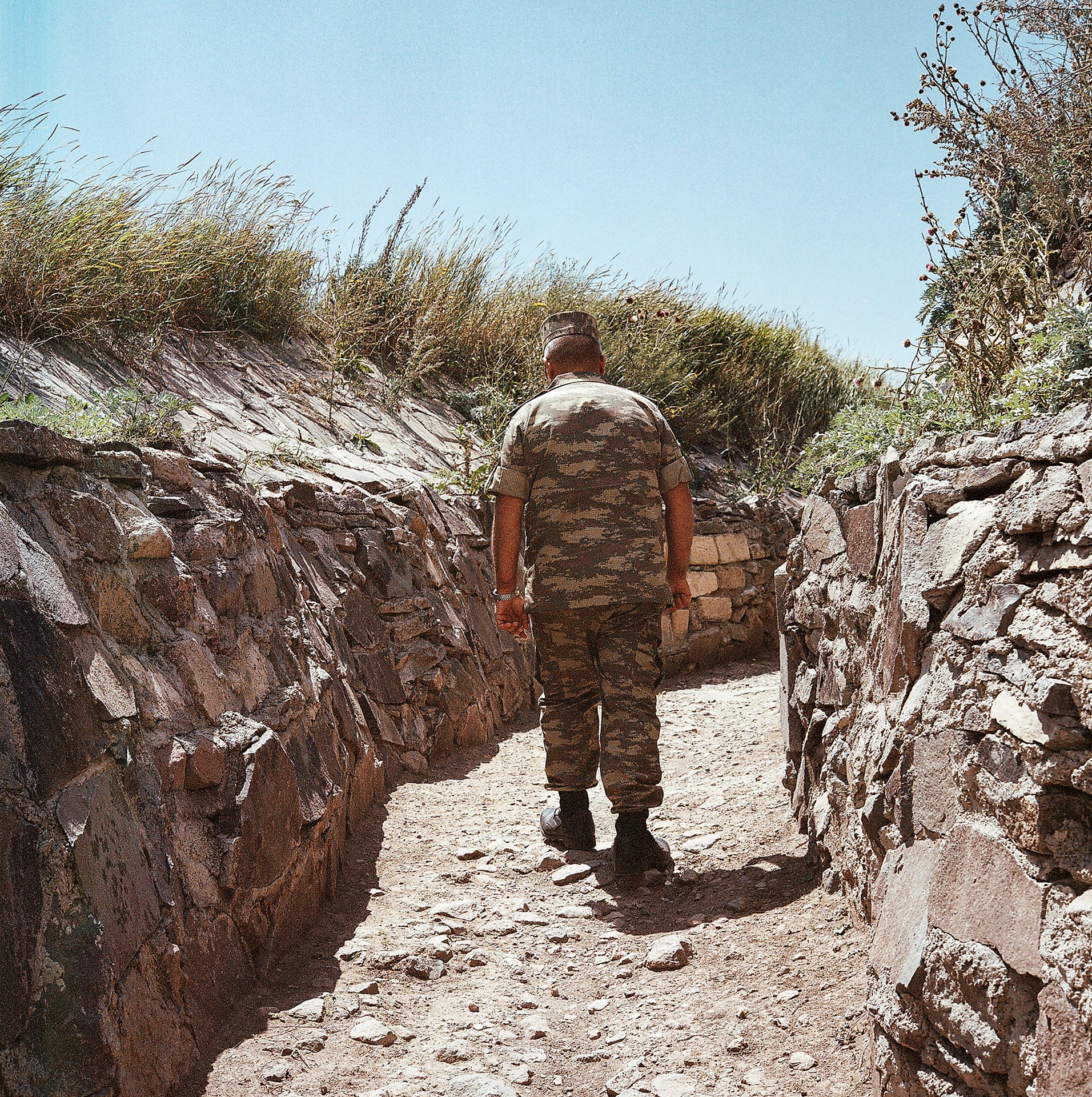 Military patrols secure the trenches near the Armenia-Azerbaijan border, which has been closed for three decades due to war. The <em>Satyrus effendi </em>butterfly, named after Rustam Effendi, the photographer&rsquo;s father, flies across this border, traversing the Zangezur mountain ridge. Nakhchivan, Azerbaijan.