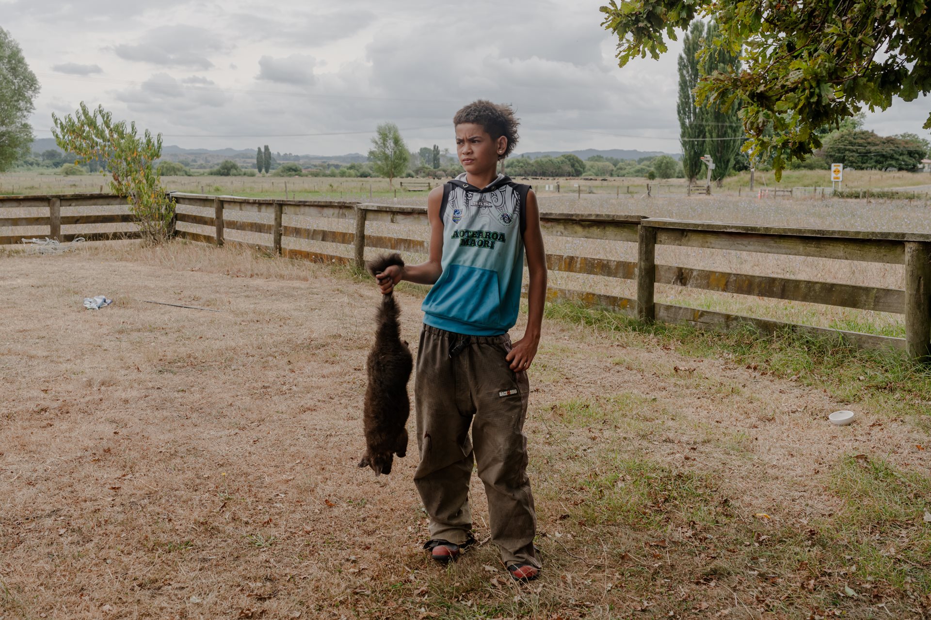 Tapu Teepa (10) holds a brushtail possum trapped in the mountainous ridges near the family farm in Ruatoki, New Zealand. Possums were introduced to New Zealand from Australia in the 19th century, in an attempt to set up a fur trade. They are now considered New Zealand&rsquo;s most damaging invasive pest, because of the havoc they wreak on farms and native forests, and fur can be sold in town for NZ$100 (US$57) a kilo.