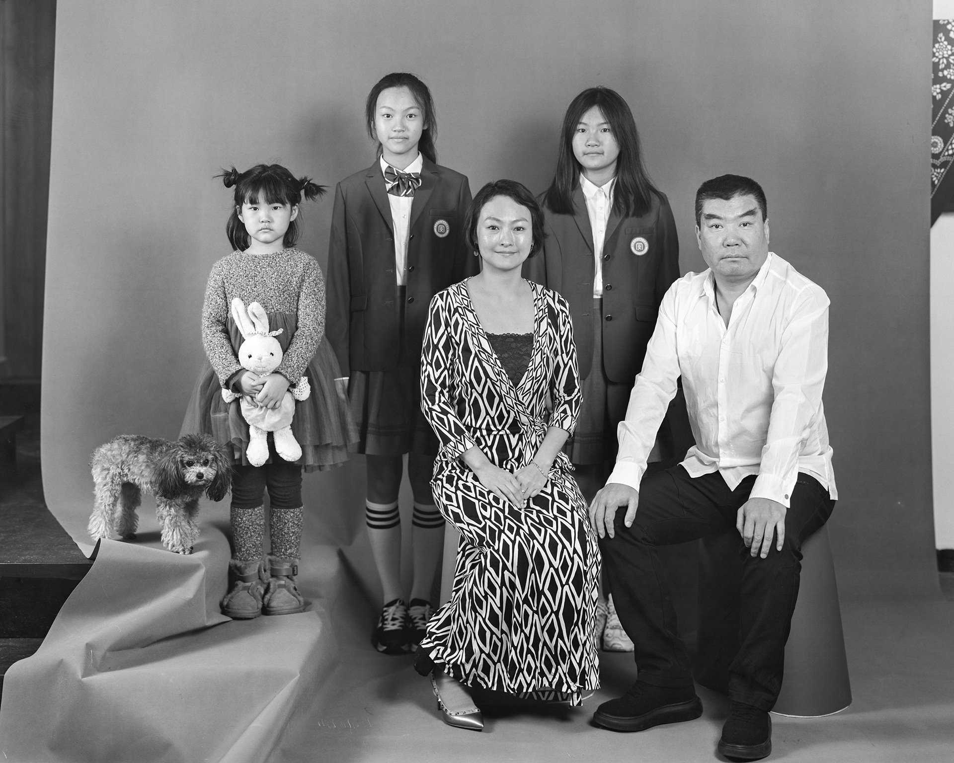 Jiuer sits for a family portrait with her husband and three daughters in Liaoning, China. She says: &ldquo;Love is the luggage that accompanies us all our lives.&rdquo;