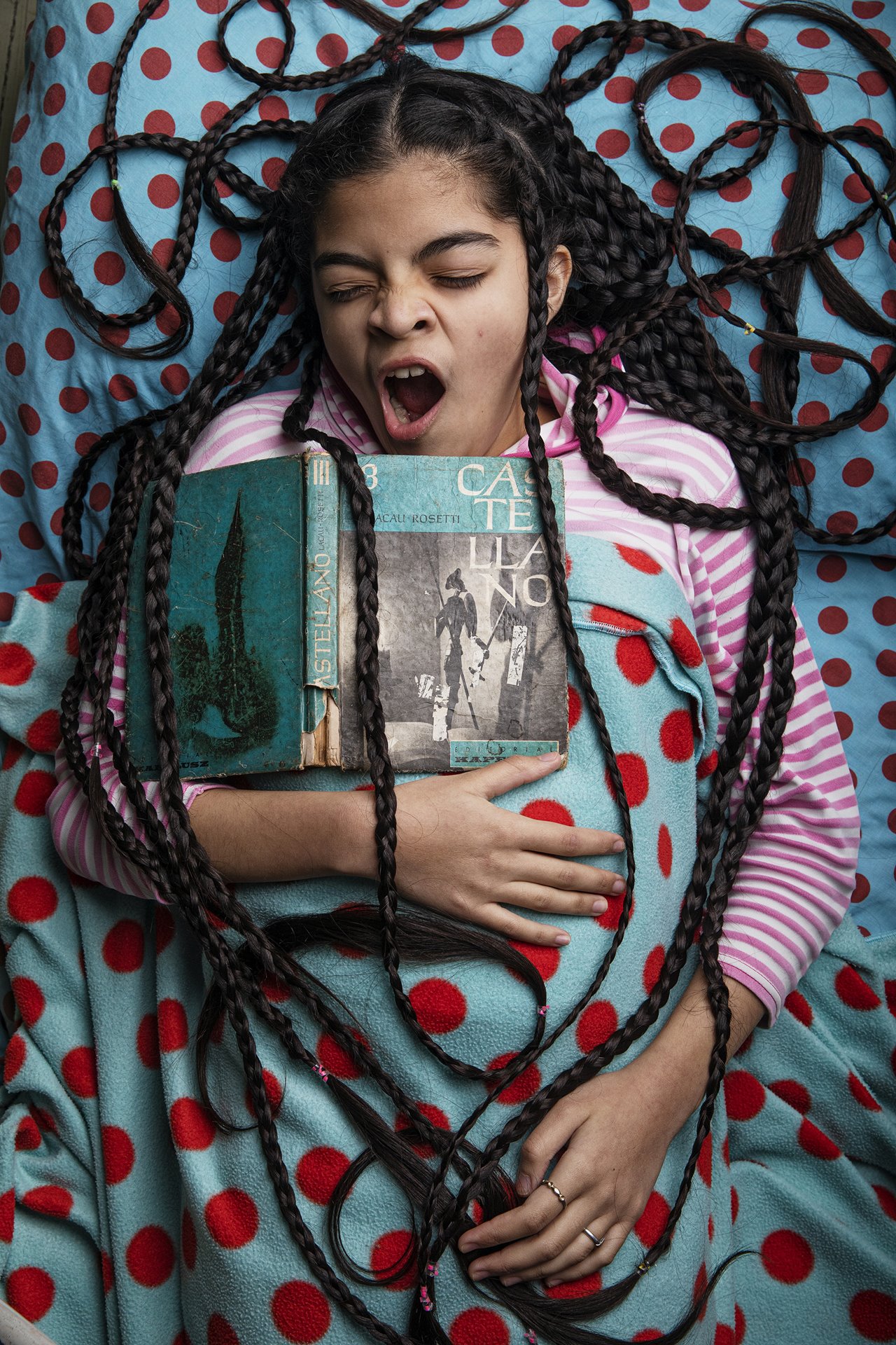 <p>Antonella yawns while studying in bed, in her room at home in Buenos Aires, Argentina. She says she feels a lack of motivation studying at home, and often studies in bed as she doesn&rsquo;t feel like getting up.</p>
