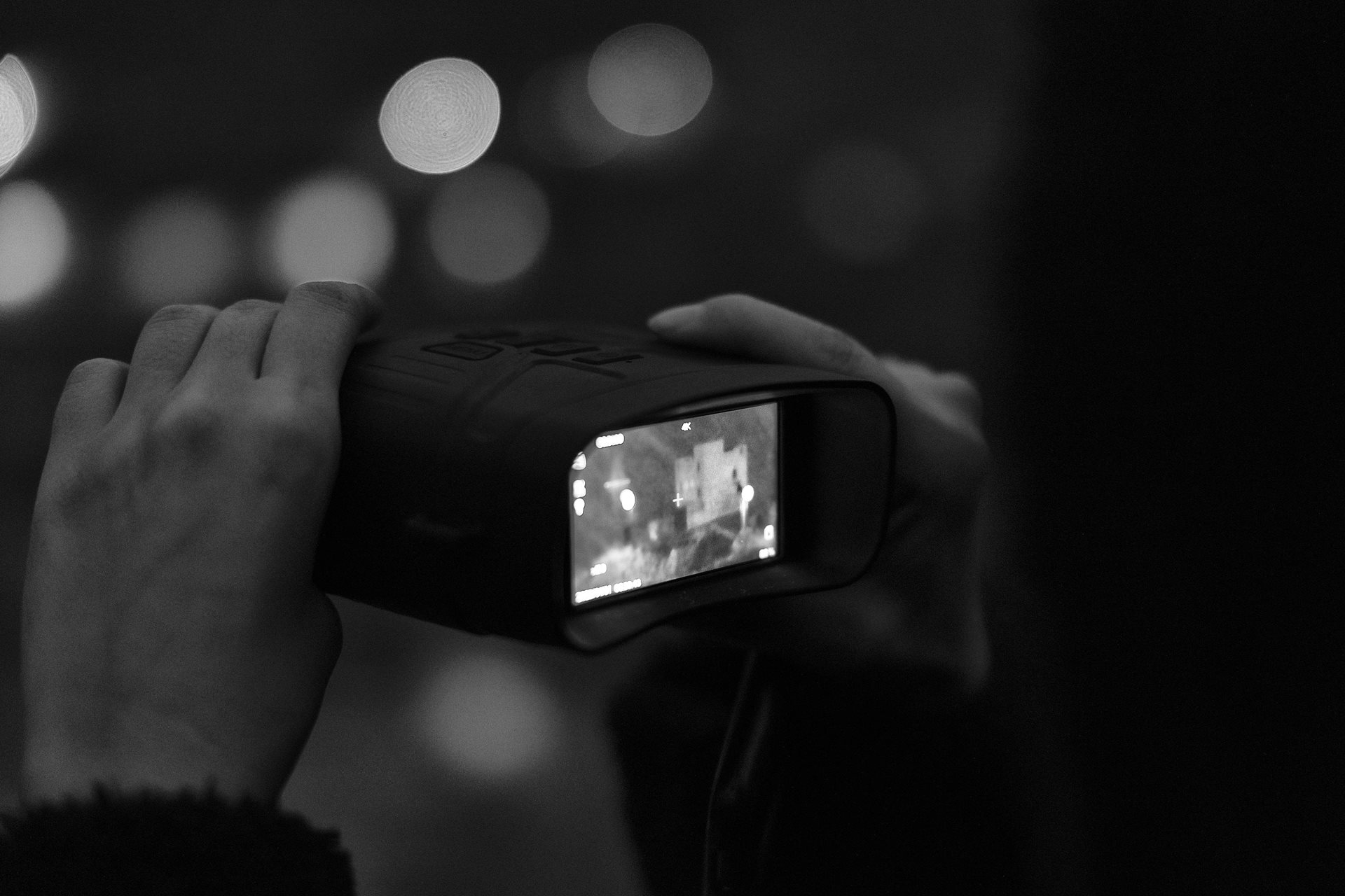 A local man inspects checkpoints on the Iran-Iraq border with a night vision camera, aiming to ensure a safer passage for kolbars hoping to cross the border undetected, in Kurdistan, Iran.&nbsp;<br />
&nbsp;
