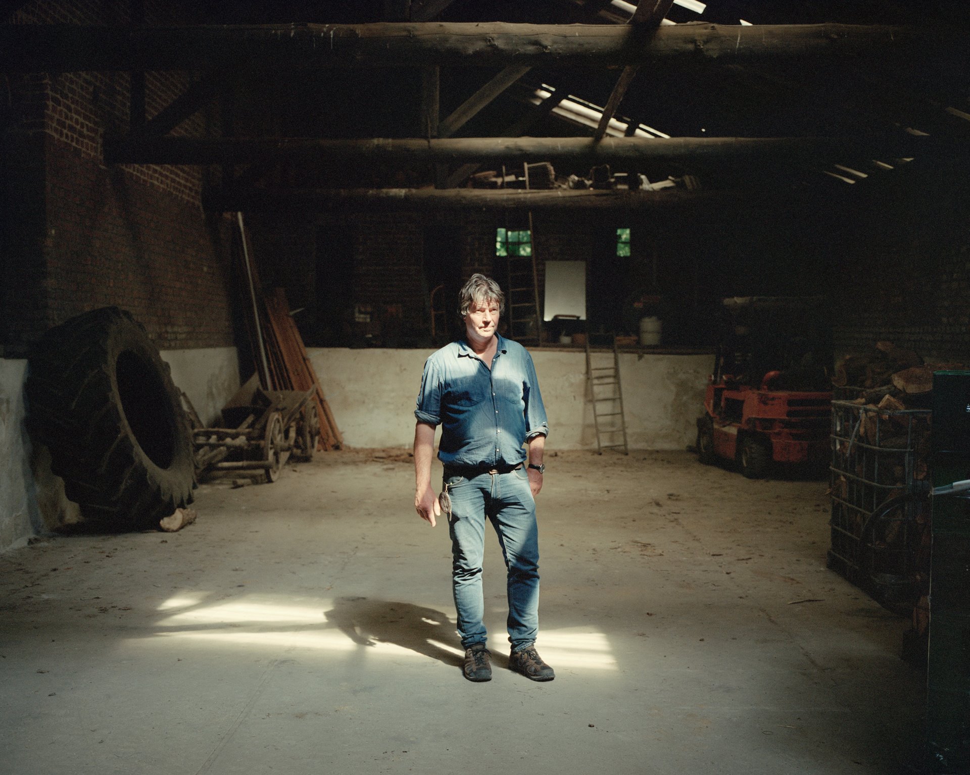 Eckardt Heukamp, the last remaining resident of Lützerath, Germany, stands for a portrait in his barn. In October 2022, he had to hand over his house to energy company RWE, which had already formally become the property of the company. Heukamp became well known for opposing the demolition of his village and letting activists live on his property there.