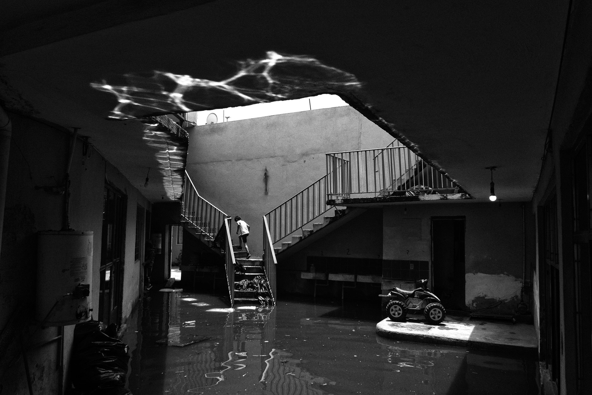 <p>A child runs up to the second floor of a partially submerged home. The 2024 floods affected 7,000 residents. Many families lost personal belongings like photographs and other cherished items. Chalco, State of Mexico, Mexico</p>
<br />
&nbsp;