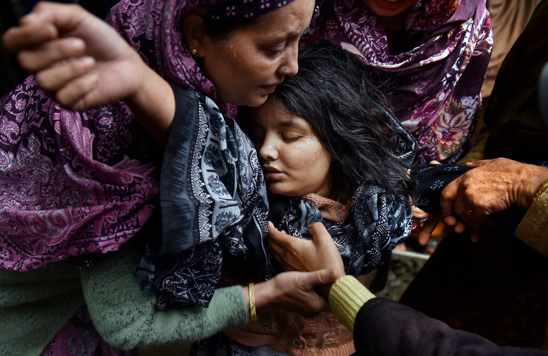 Sanam Bashir (21) collapses with grief at her mother&rsquo;s funeral. Nargis Begum (45) died from shrapnel wounds after a mortar shell struck while the two were fleeing their home in Uri, Indian-administered Jammu and Kashmir.