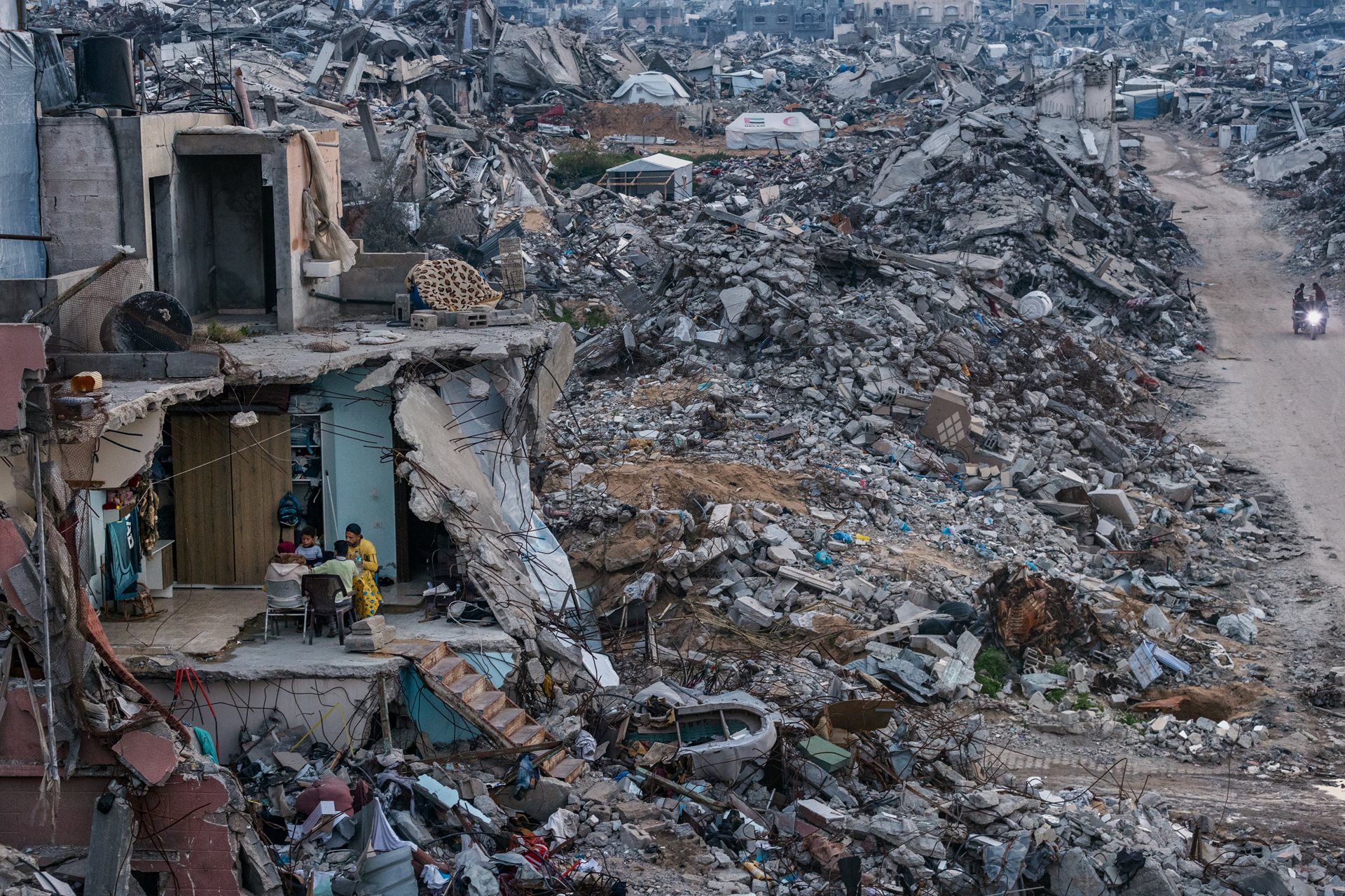 Tamer Hassan al-Shafei and his family break their Ramadan fast in the remains of their home in &nbsp;Beit Lahia, Gaza Strip. Food shortages meant only basics were served instead of the usual spread.