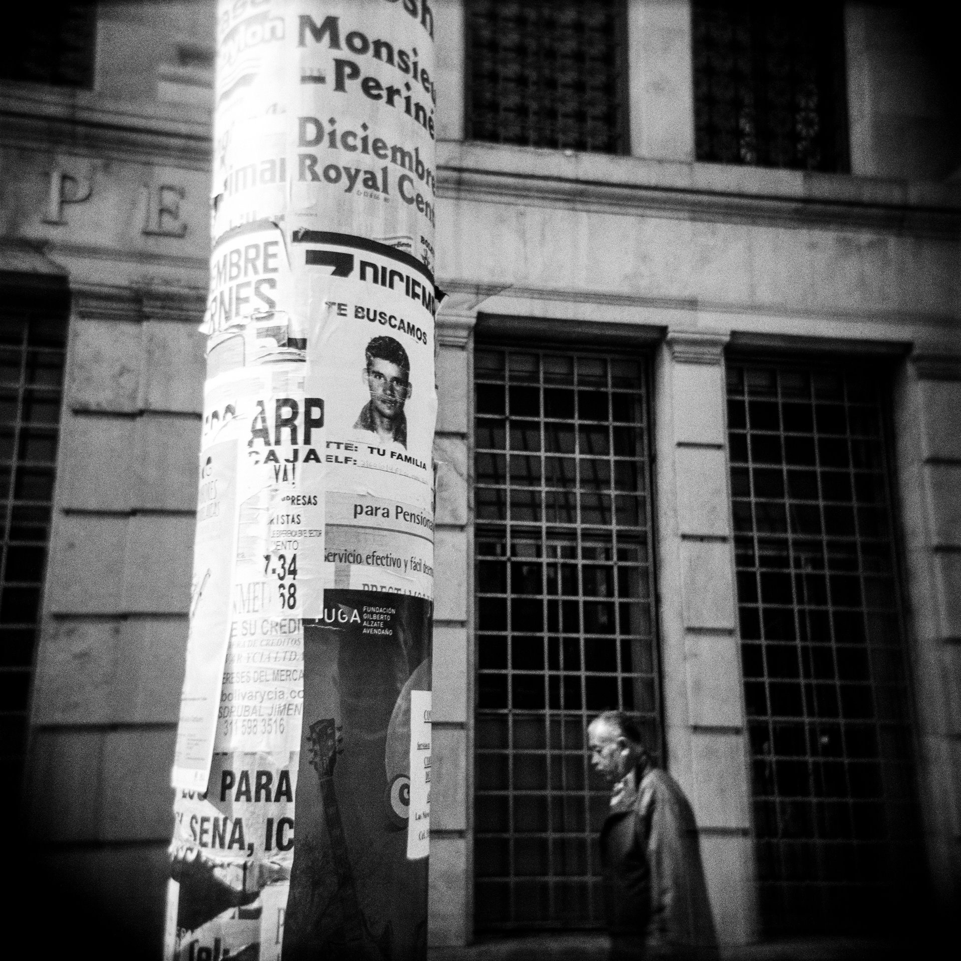 A poster with the photo of a missing person glued to a lamppost in Bogotá, Colombia, reads: &rsquo;We are looking for you. Your family.&#39;