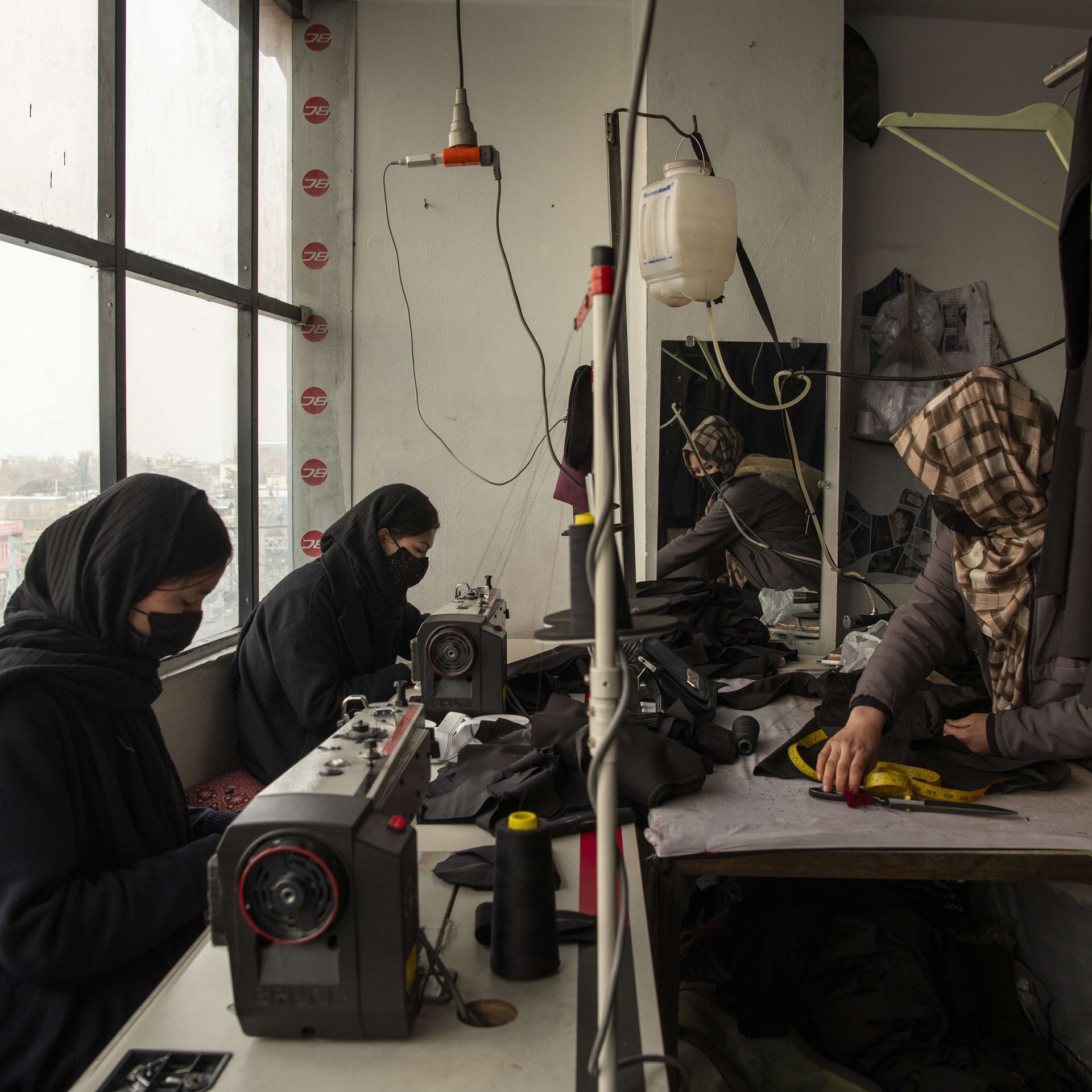 Rahila (20), Yalda (18), and Zeinab (14) are themselves denied further education, but make uniforms for younger girls at elementary school, at a sewing workshop, in Kabul, Afghanistan. Zeinab was just about to enter Grade 7 when the Taliban banned school for girls above Grade 6.