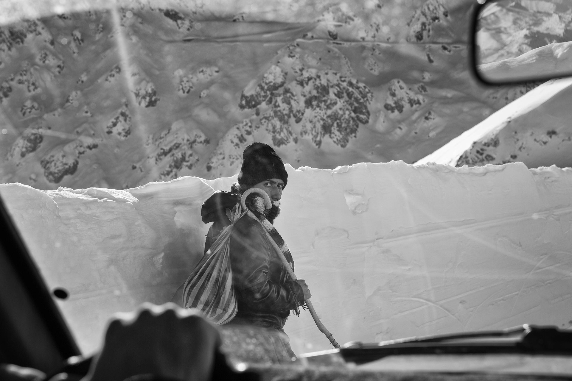 A kolbar walks back to his village in Kurdistan, Iran, after delivering a heavy load. &quot;We survived another day,&quot; he says.