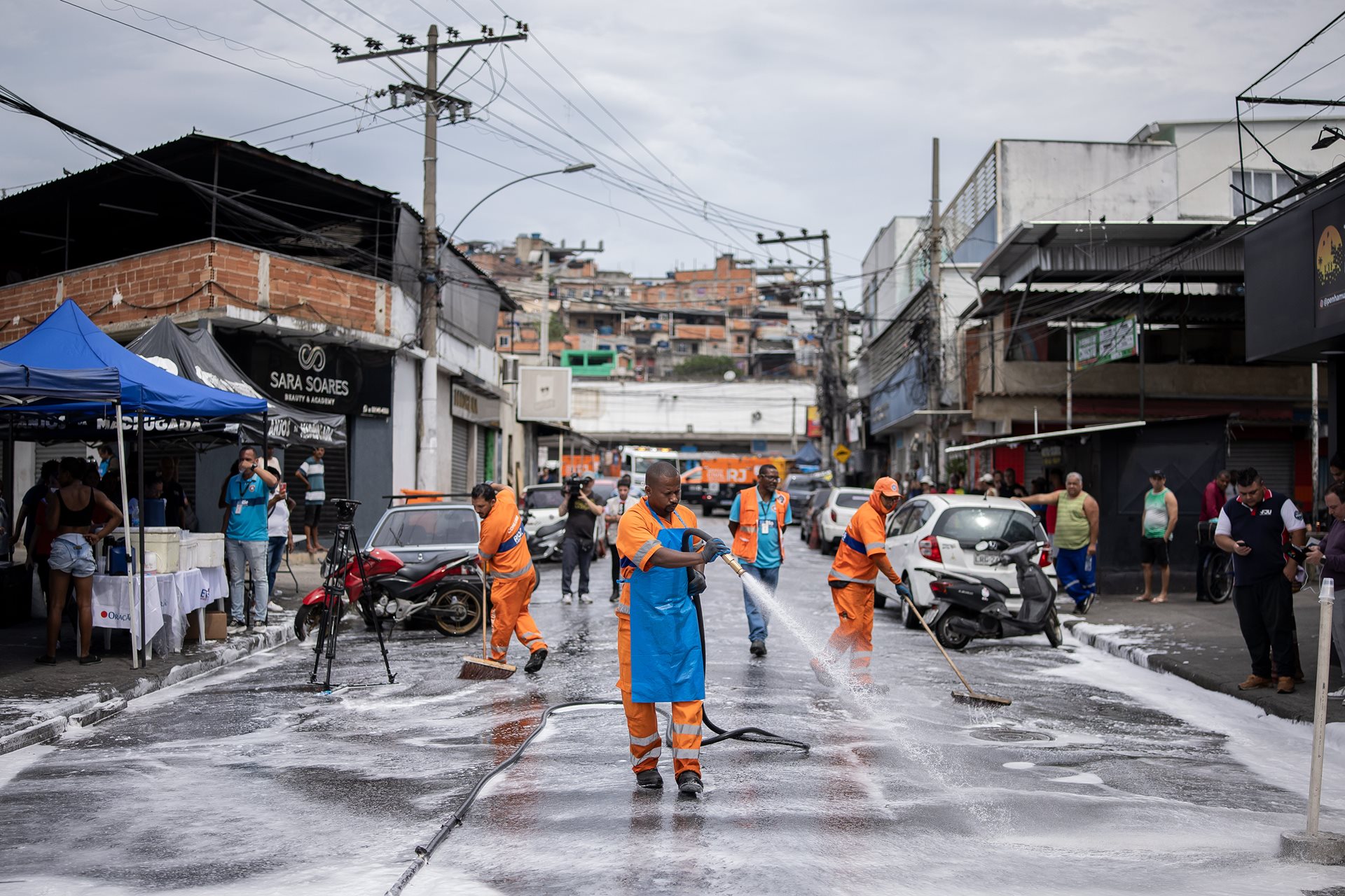 Municipal workers wash away blood in São Lucas Square, Rio de Janeiro, Brazil. Despite the unprecedented death toll and failure to apprehend key gang leaders, the governor of Rio de Janeiro declared the operation a success for public security.&nbsp;