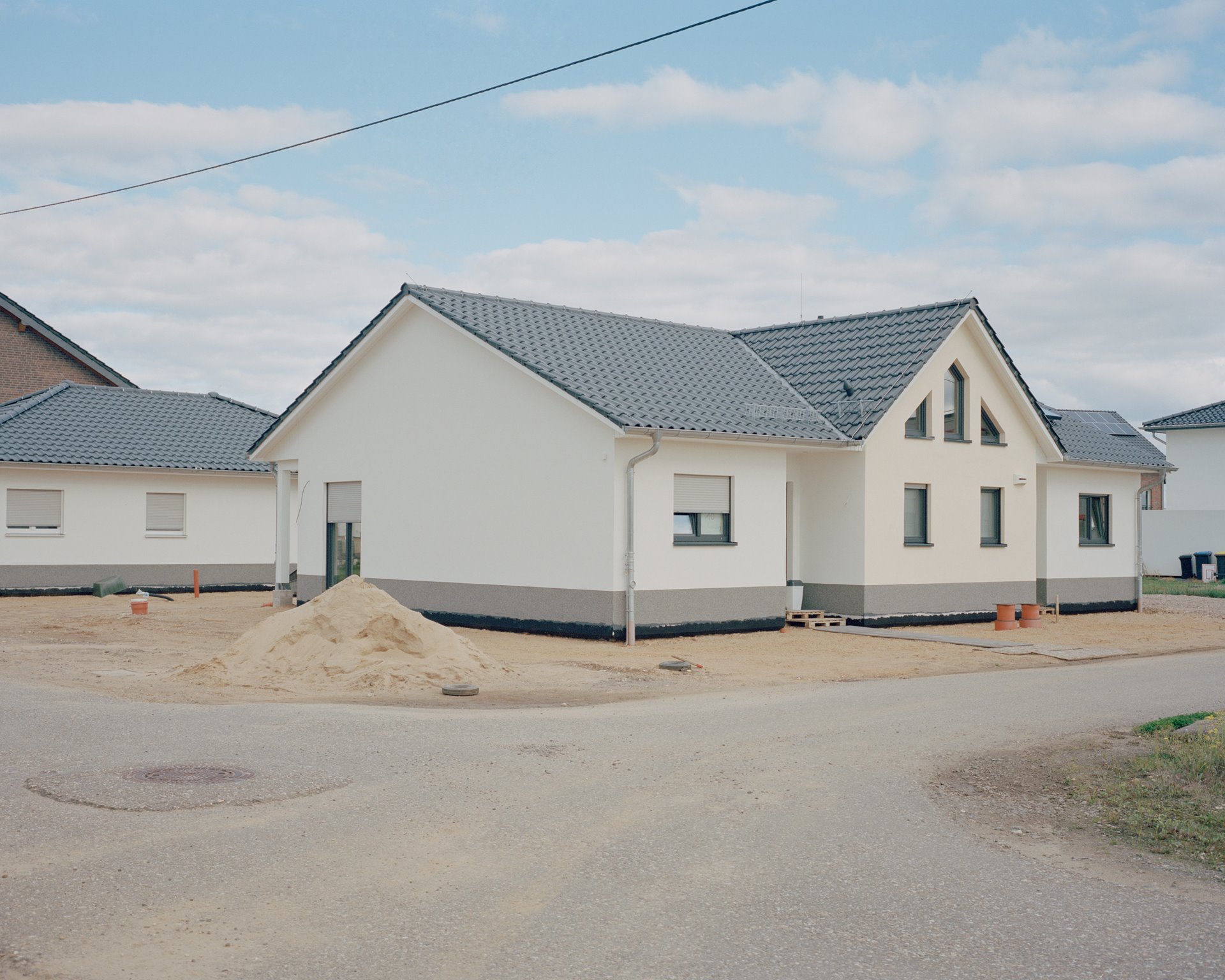 A newly built house stands at the Manheim-neu resettlement site, located a few kilometers away from the original village of Manheim, Germany. The ground-breaking ceremony for Manheim-neu took place in 2012. Around 1,630 people live there today.