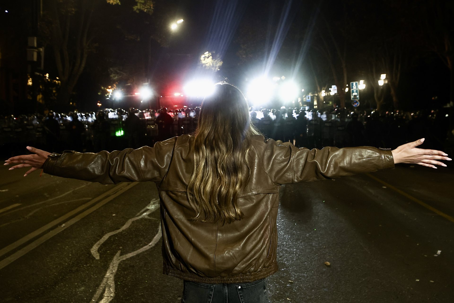 A woman confronts riot police during a rally outside the Parliament of Georgia, on Rustaveli Avenue, in Tbilisi. Police had brought water cannons onto the avenue to disperse protesters.&nbsp;