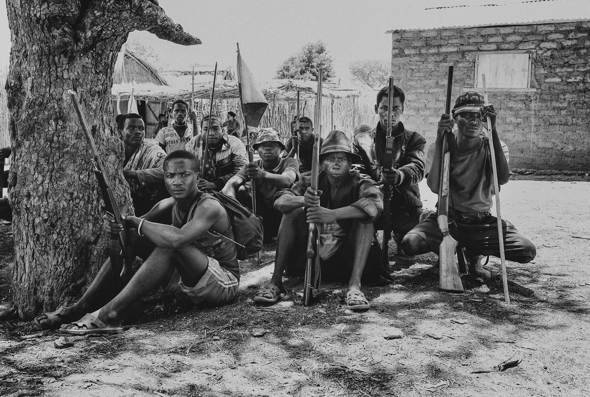 Members of the Fokonolona community from Betioky meet in the neighboring village of Behahitse, in the Ampanihy district of southern Madagascar, for a reconciliation ceremony following conflict over the theft of a bicycle. The Behahitse community will pay the men from Betioky nine zebu in recompense. To seal the pact, a long kabary (a poeticized speech) will be made, and a zebu killed and shared.